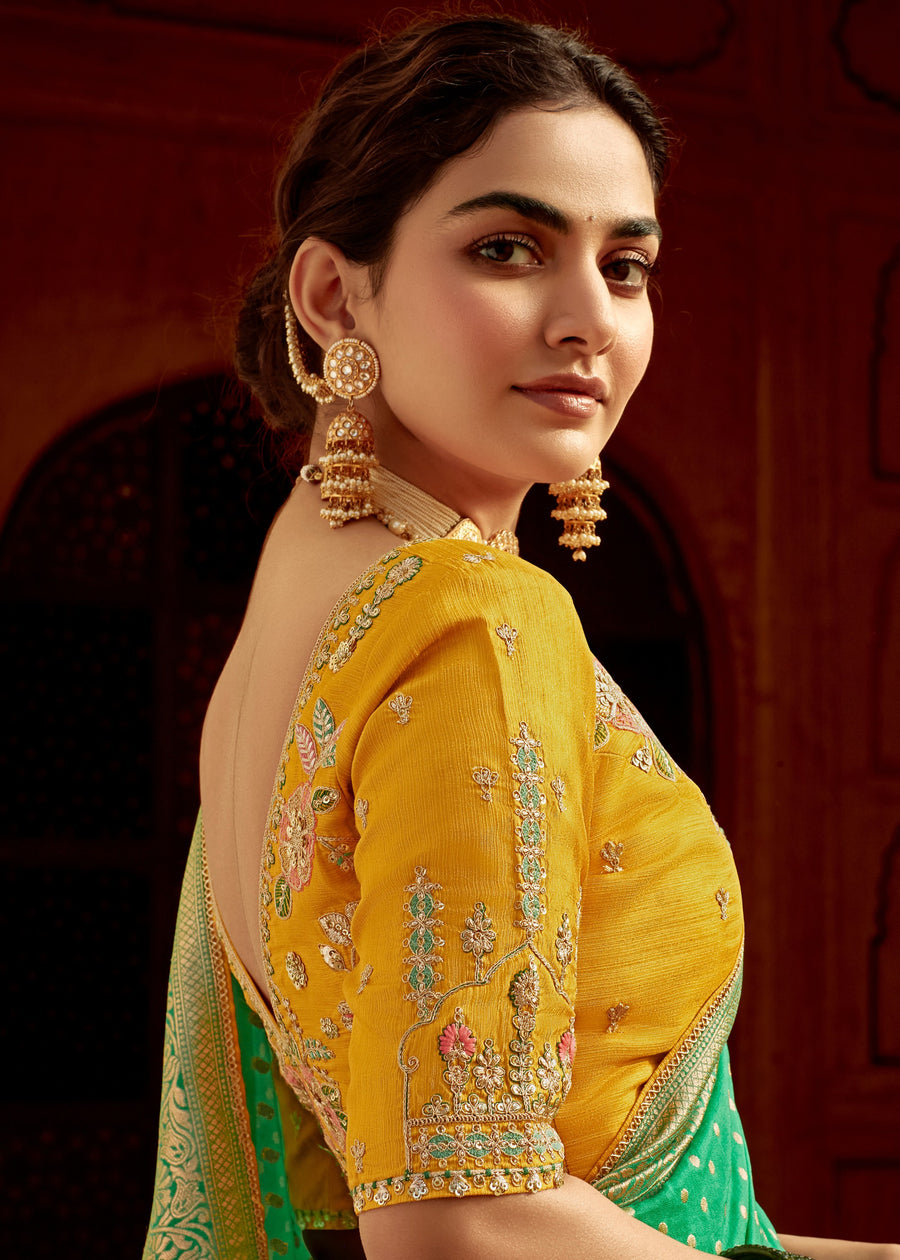 Dola Banarasi Silk Emerald Green Saree With Contrast Yellow Embroidered Blouse