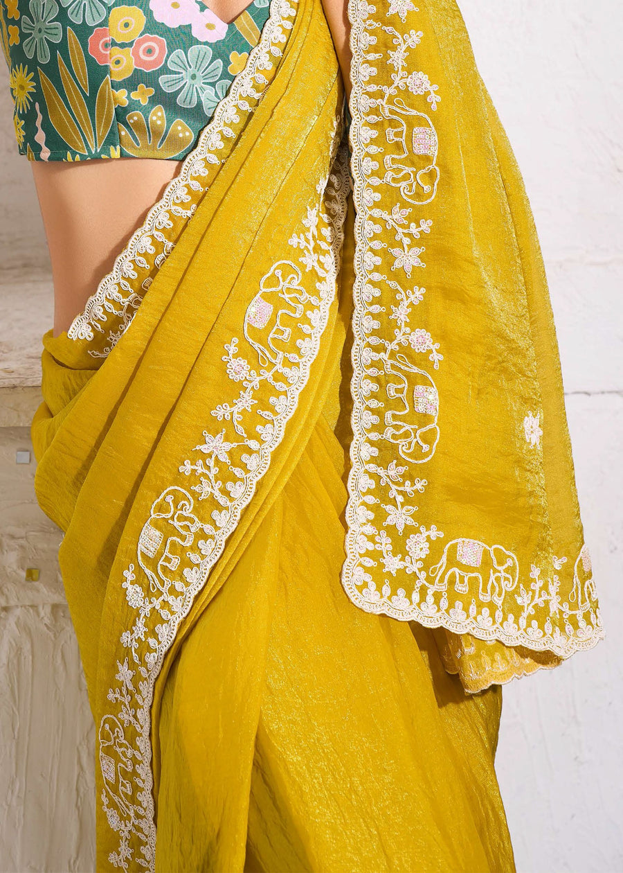 Crushed Tissue Yellow Embroidered Saree & Green Printed Blouse