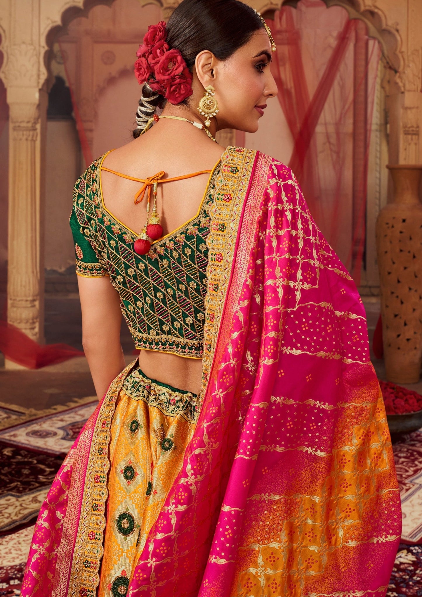 Bride back pose in banarasi silk lehenga choli and dupatta.