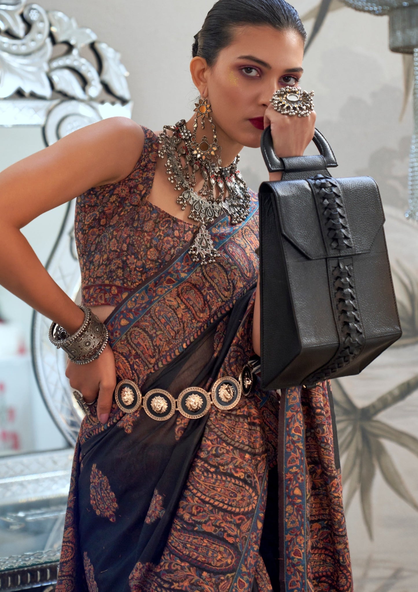 Woman in black pure kashmiri silk handloom saree blouse.
