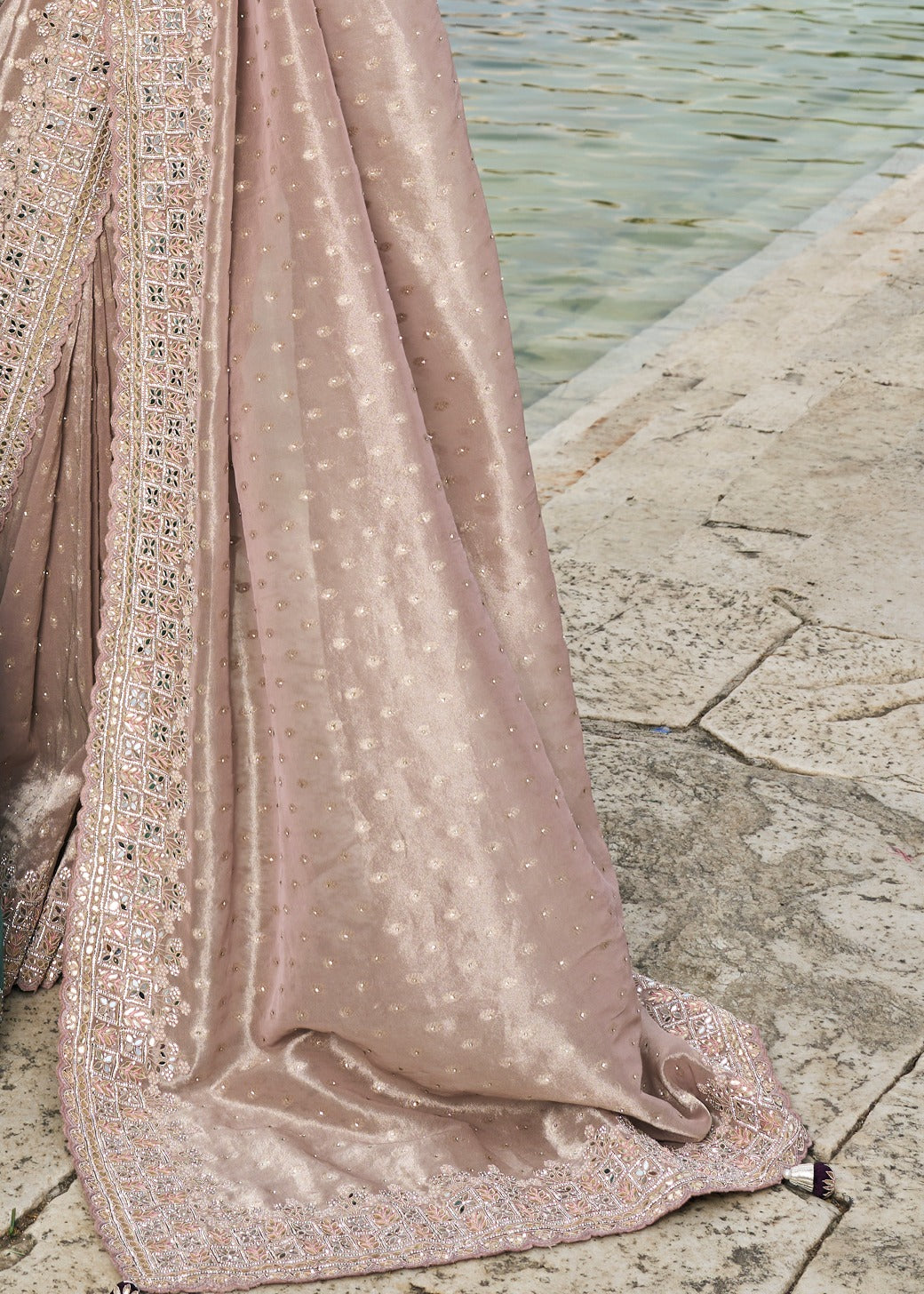 Bridal peach banarasi silk saree online with luxury mirror work hand embroidery and zari details.