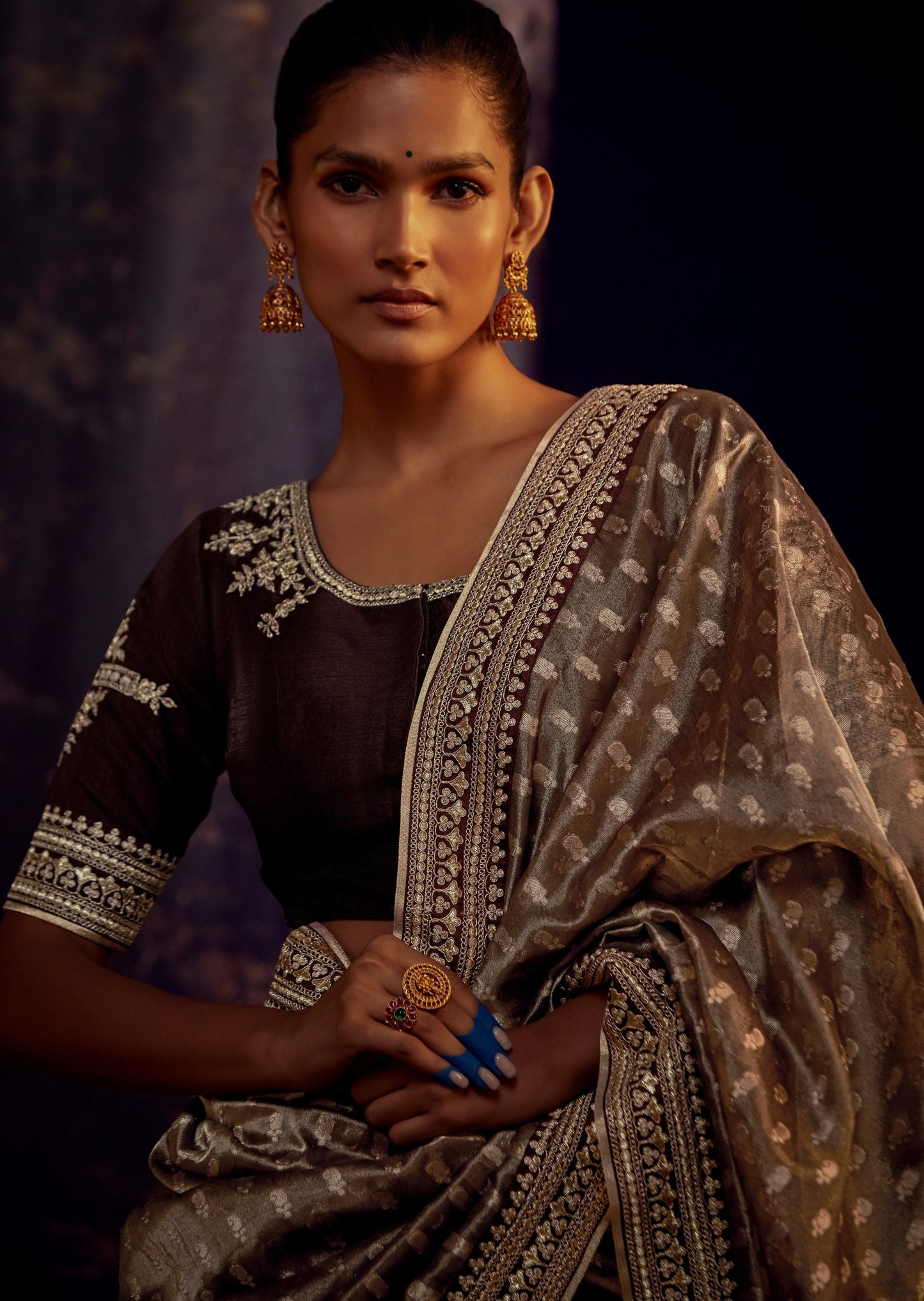Hand embroidery work on banarasi organza saree blouse.