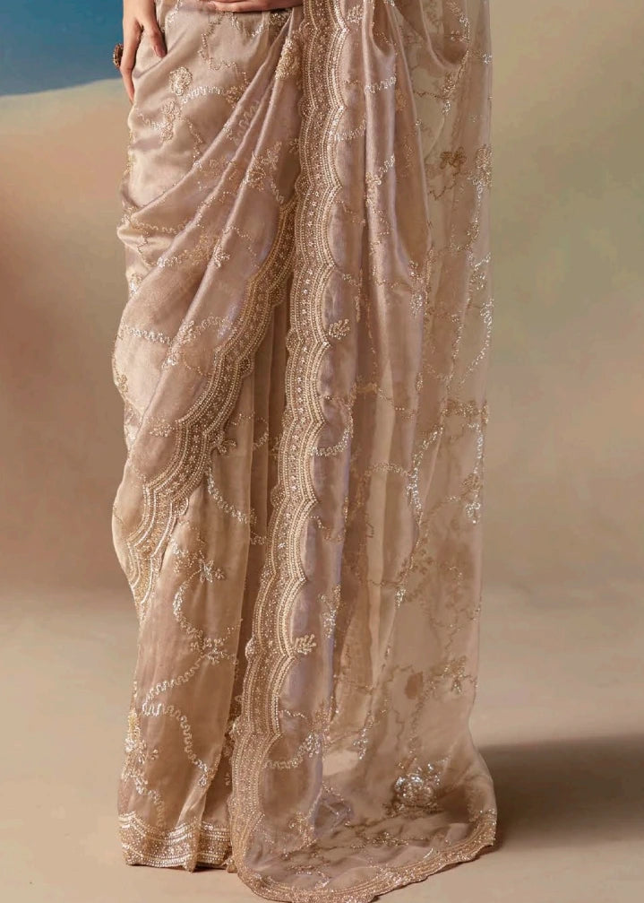 Designer beige organza tissue silk saree with luminous beadwork and sequin hand embroidery for luxury bridal trousseau. engagement or sangeet look.