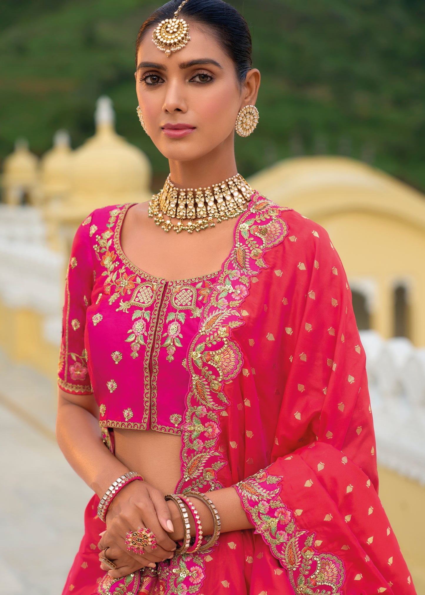 Designer bridal silk lehenga choli online USA in pink color featuring traditional design with embroidery work and a matching dupatta.