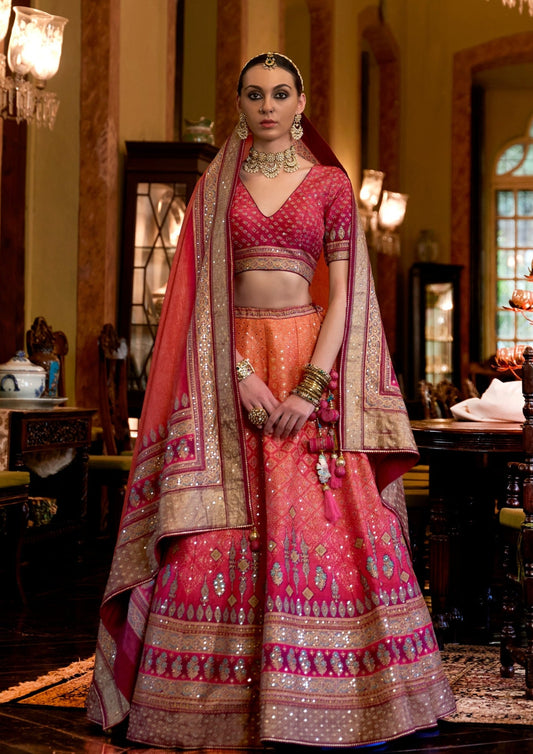 bride in pink orange color comnination lehenga choli