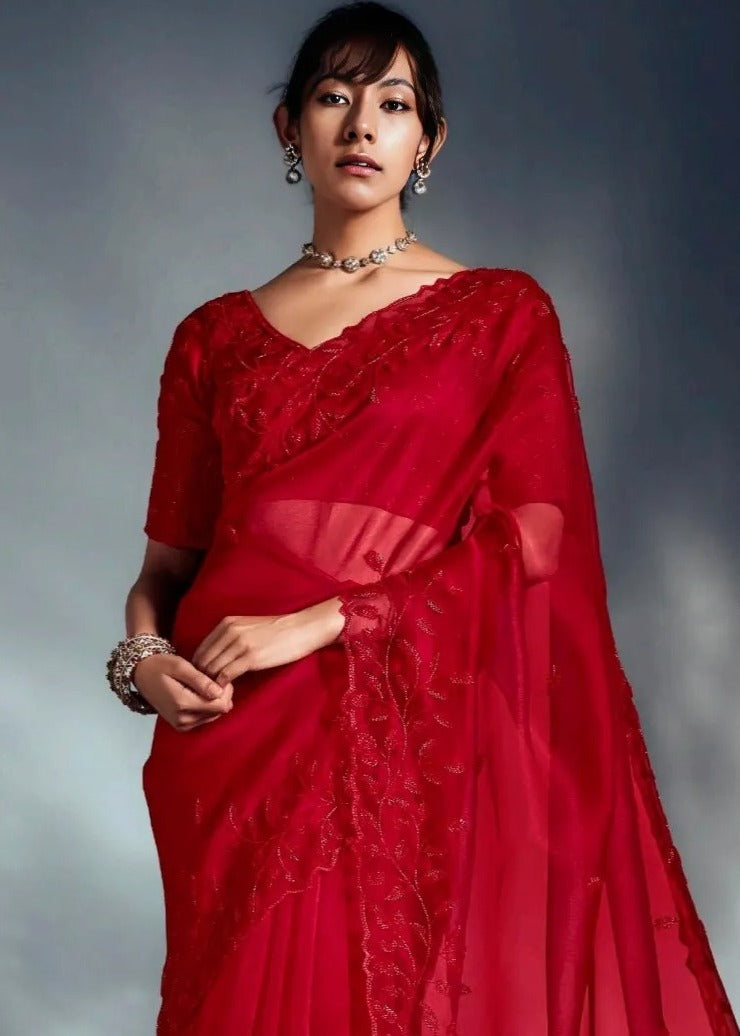 Designer red bridal saree in organza tissue silk fabric featuring delicate hand embroidery and sequin highlights.