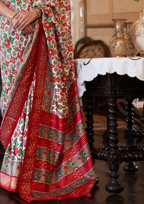 White double ikkat patola silk saree pallu design online shopping india.