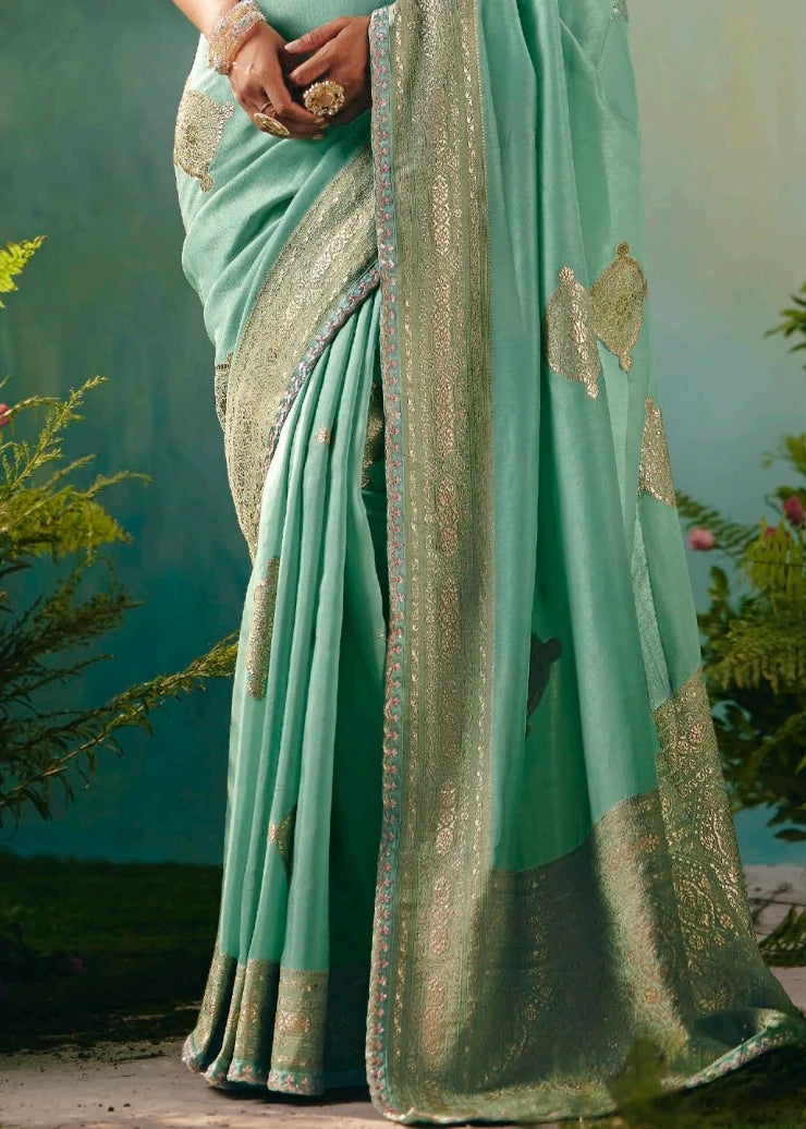 Elegant sea green banarasi silk bridal saree pallu design with embroidered border for weddings and festive occasions.
