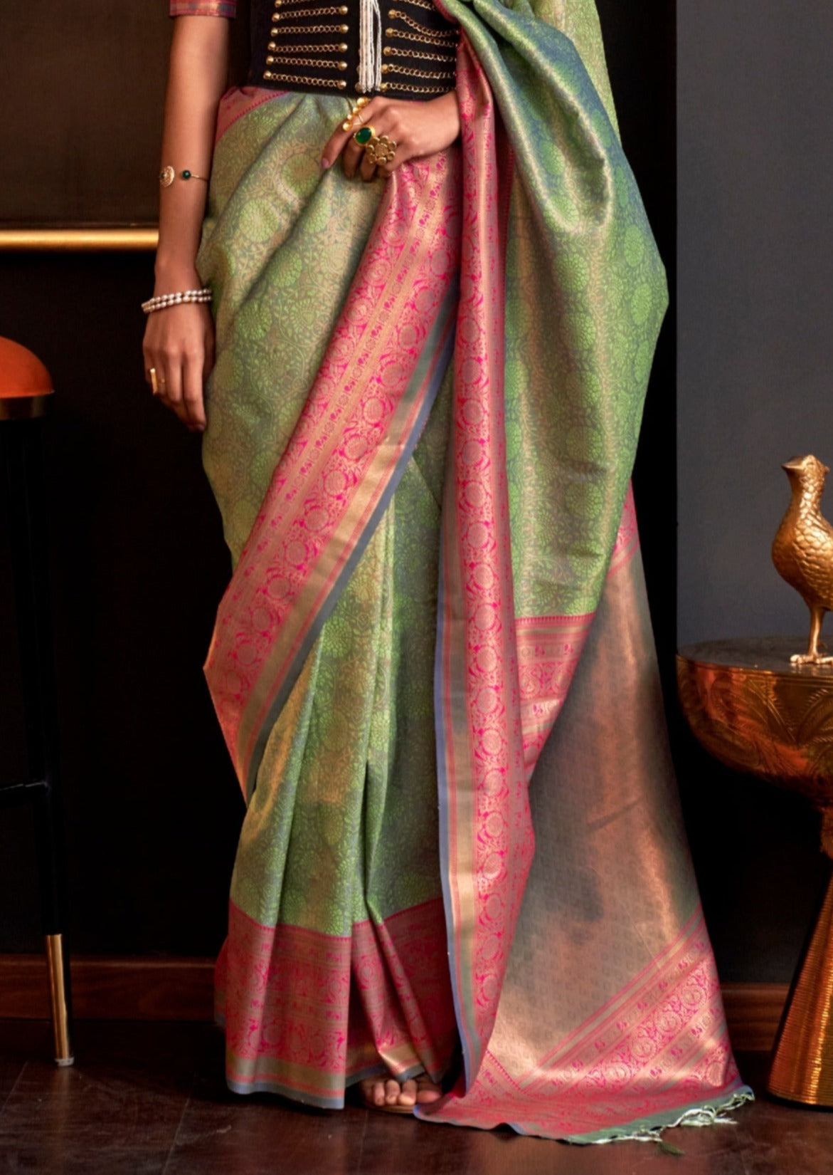 Green kanjivaram saree contrast pink blouse online.