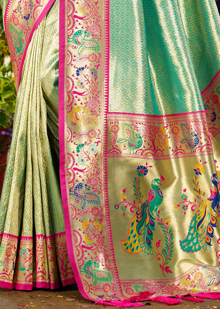 Ovean green paithani silk saree design in usa with colorful saree with peacock patterns and a pink border.