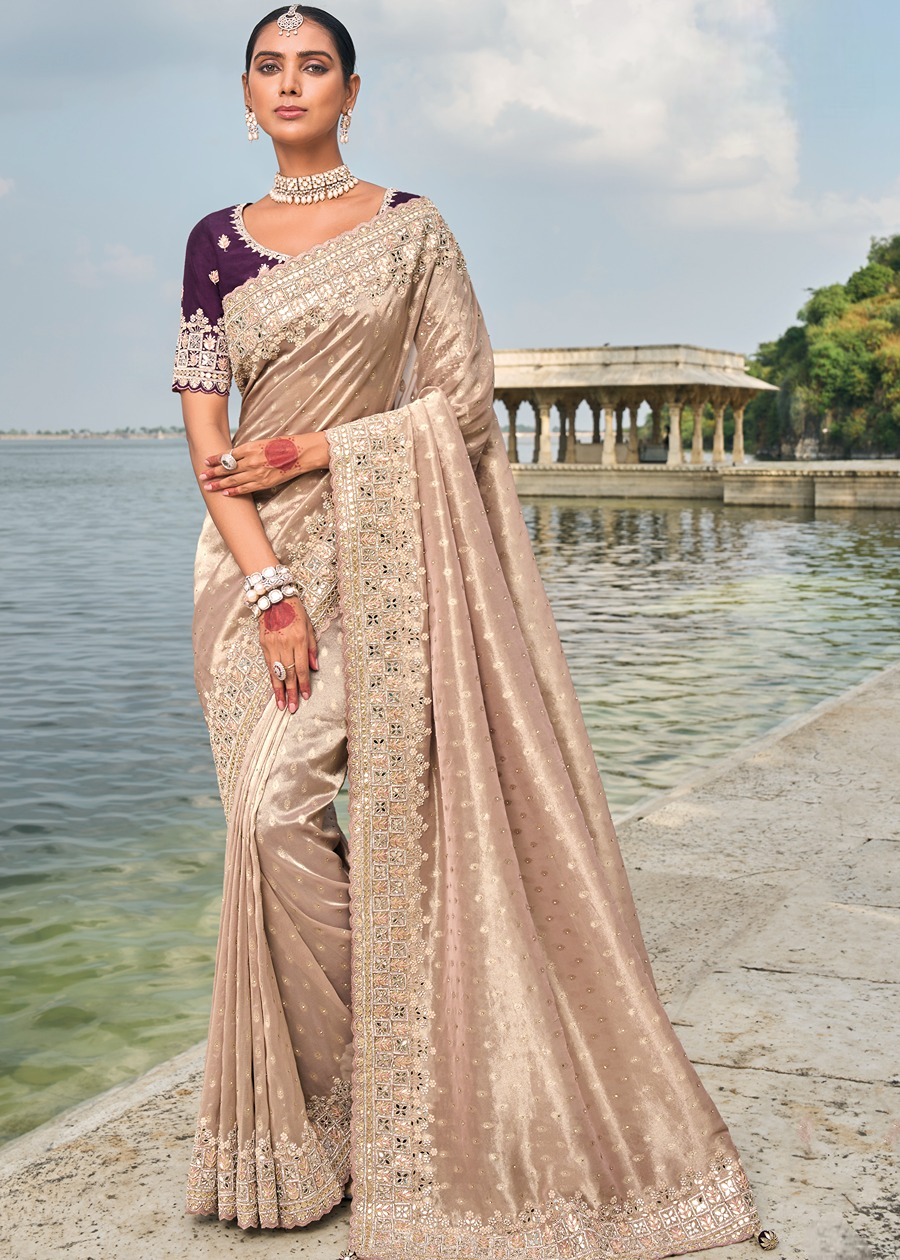 Hand embroidered luxury peach banarasi silk saree online with mirror and bead work for wedding and reception.