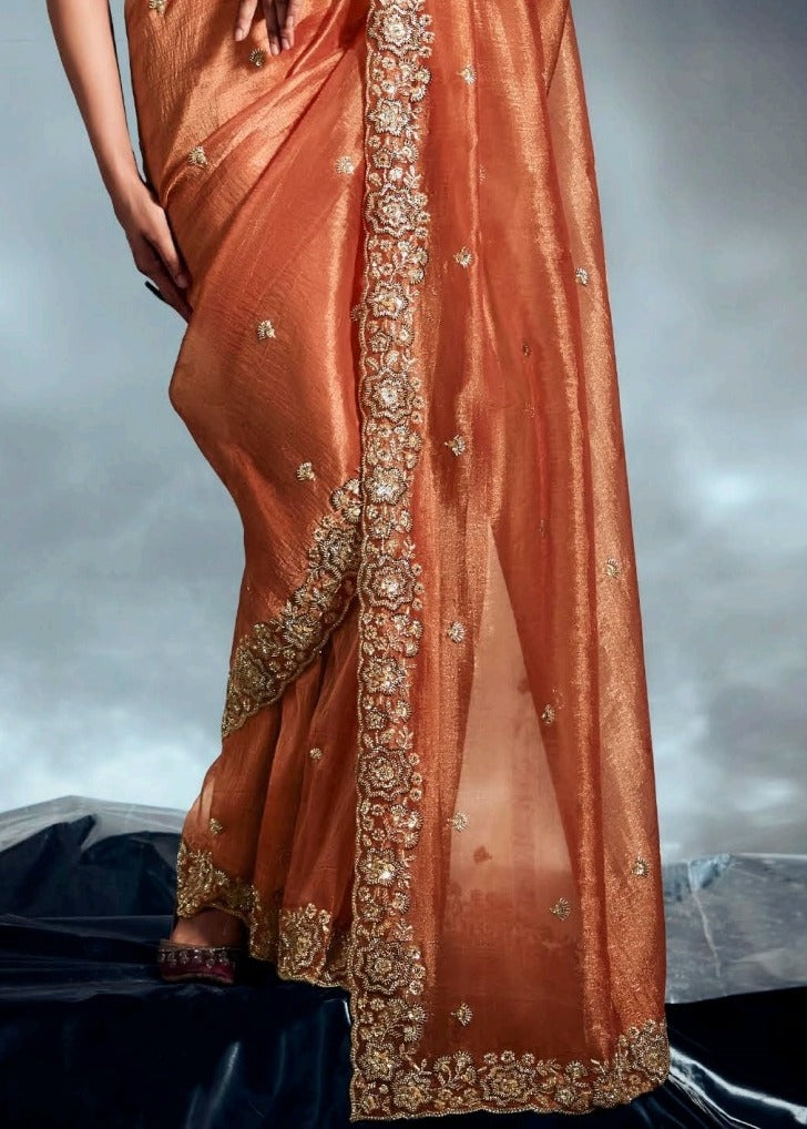 Rust orange tissue silk saree with fine hand embroidery work for sale online.