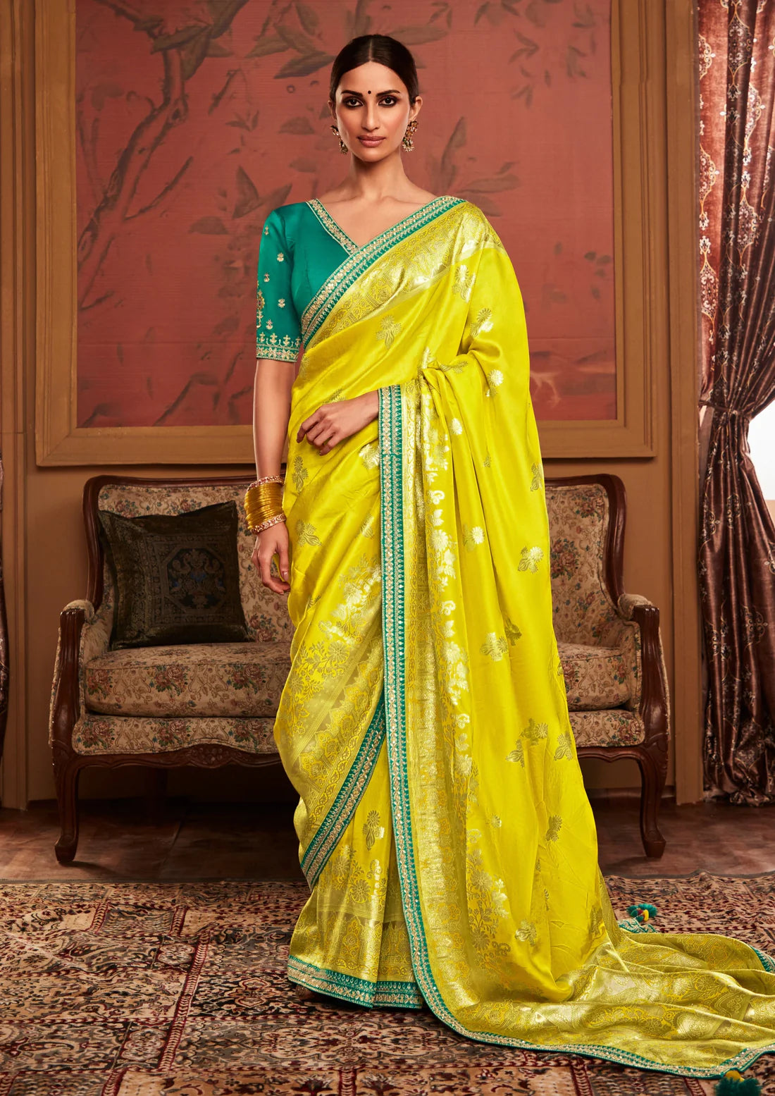 Hand embroidery work banarasi silk turmeric yellow zari saree online.