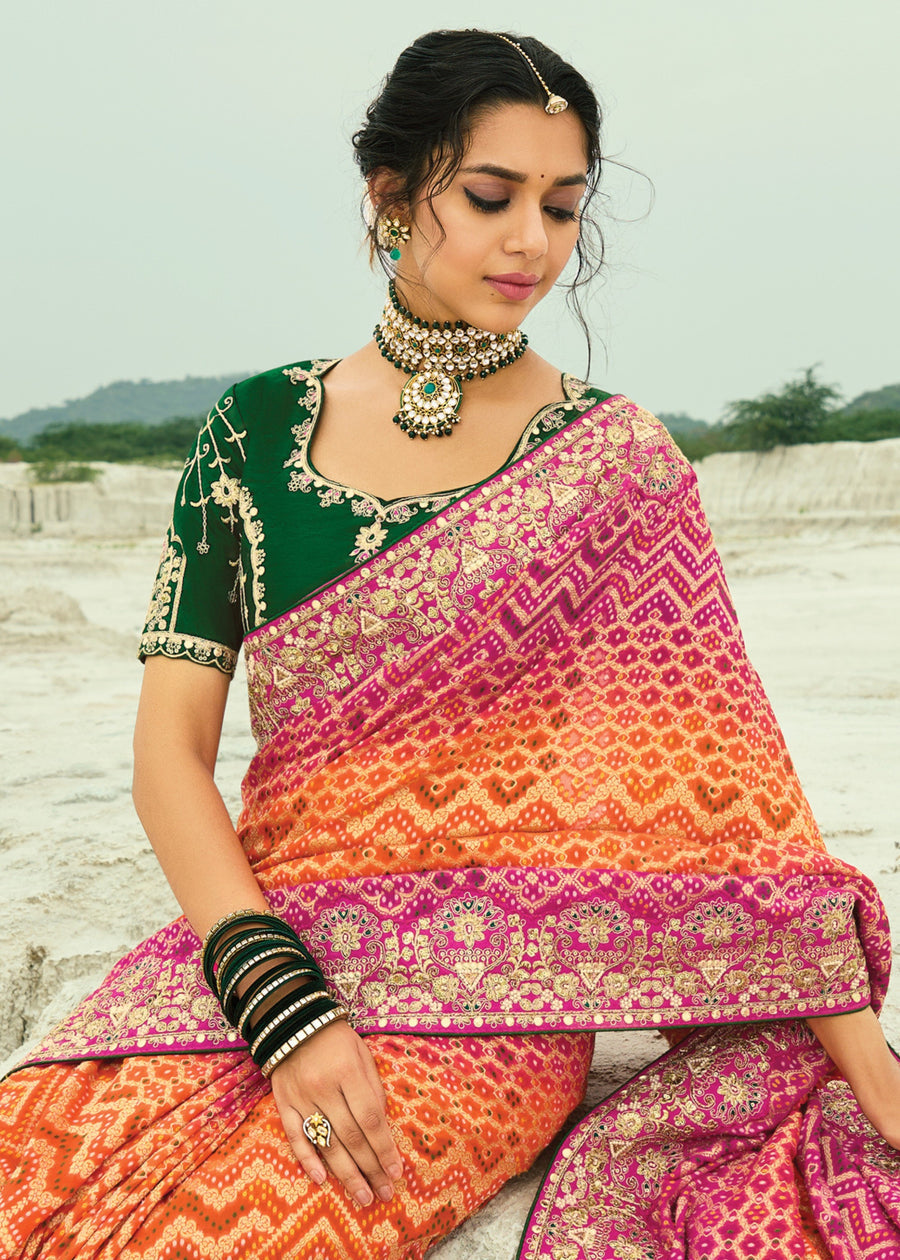 Handcrafted khaddi georgette bandhani ombre saree in orange and rani pink with elegant embroidery designs.