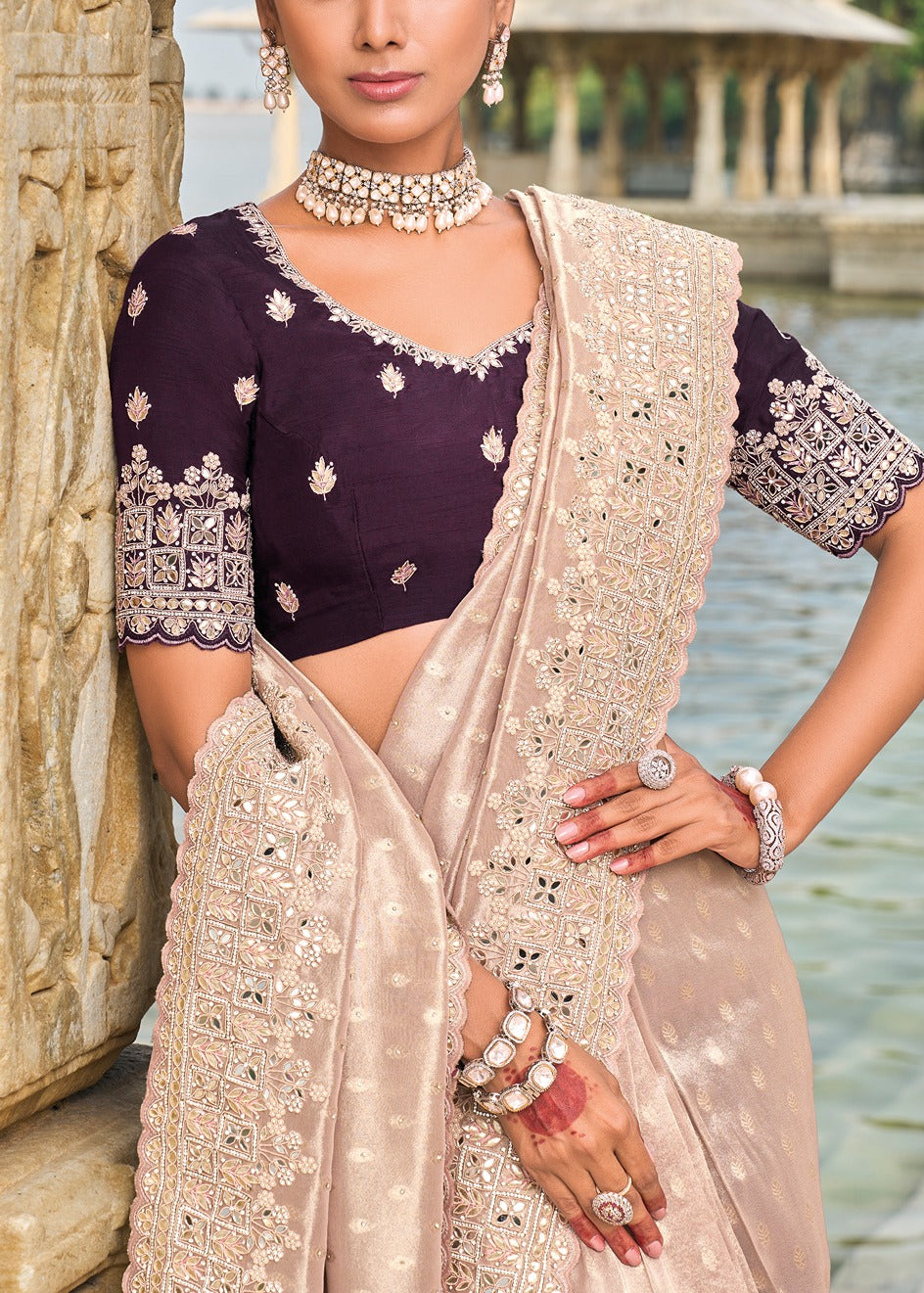 Luxury peach banarasi silk saree with purple blouse featuring hand embroidery for Indian brides and bridesmaids.