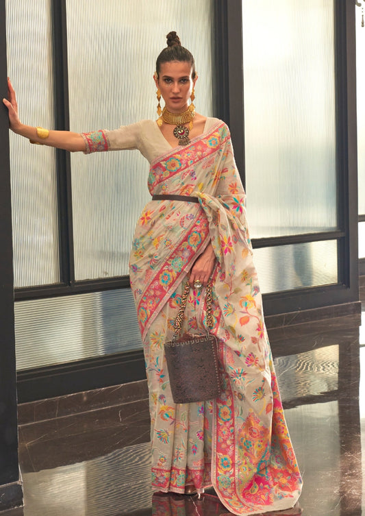 woman standing in Kashmiri Jamawar Silk Hand Emroidered White Saree and necklace