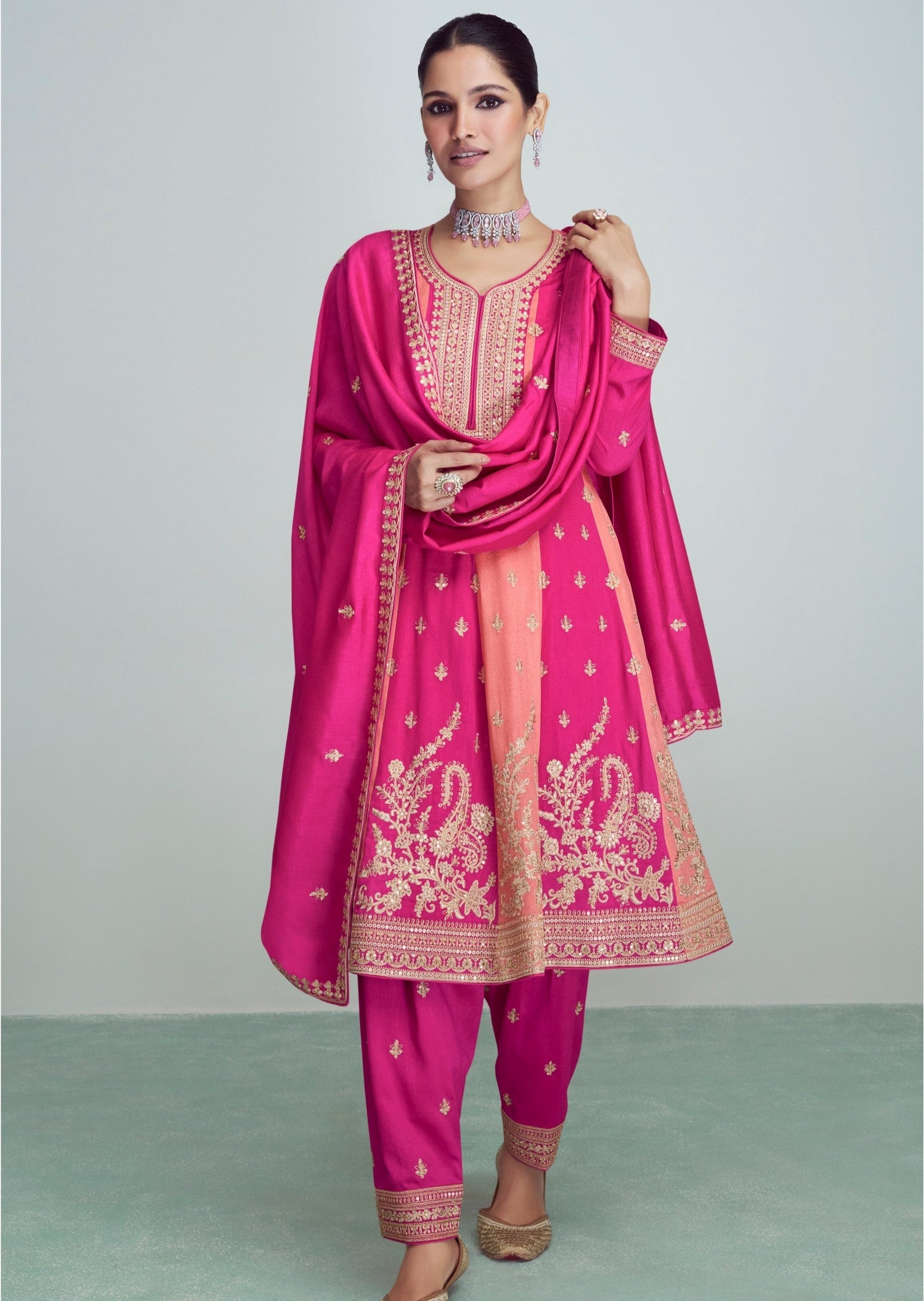 Woman in pink silk bridal salwar suit