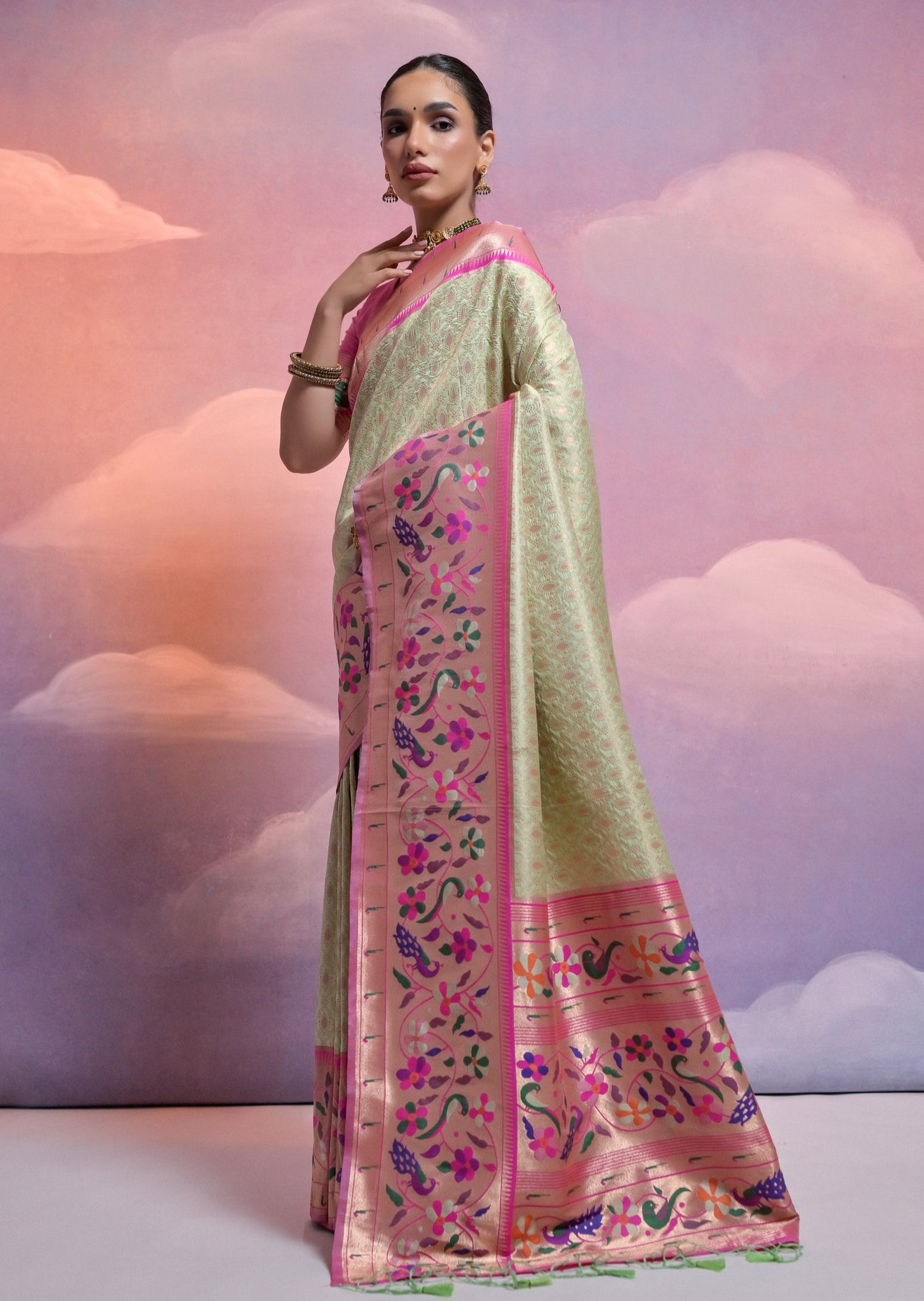 Pista green colour triple muniya border paithani silk saree online.
