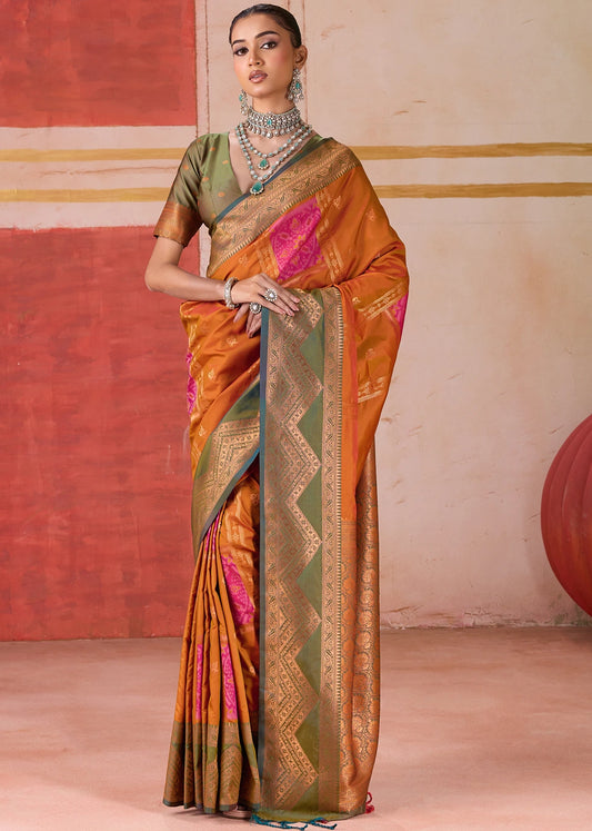 Pochampally Patola Silk Orange Ikkat Saree with Mehendi Green Border and Blouse, showcasing traditional Indian handwoven craftsmanship, perfect for weddings and festivals.