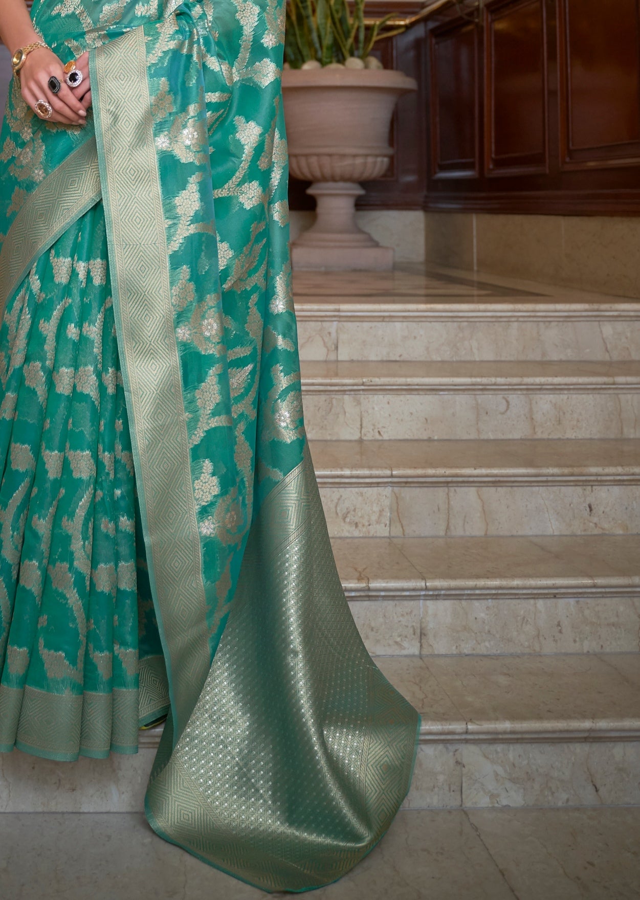 Green color pure banarasi organza zari handloom saree pallu design.