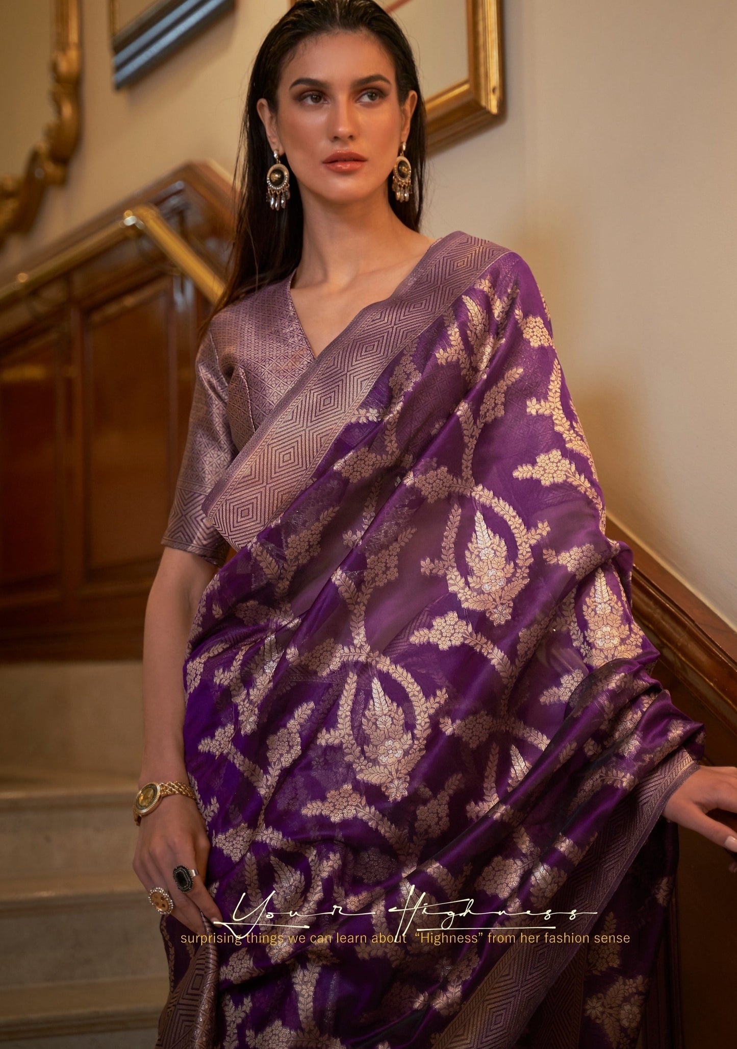 woman in violet colour banarasi organza saree looking straight.