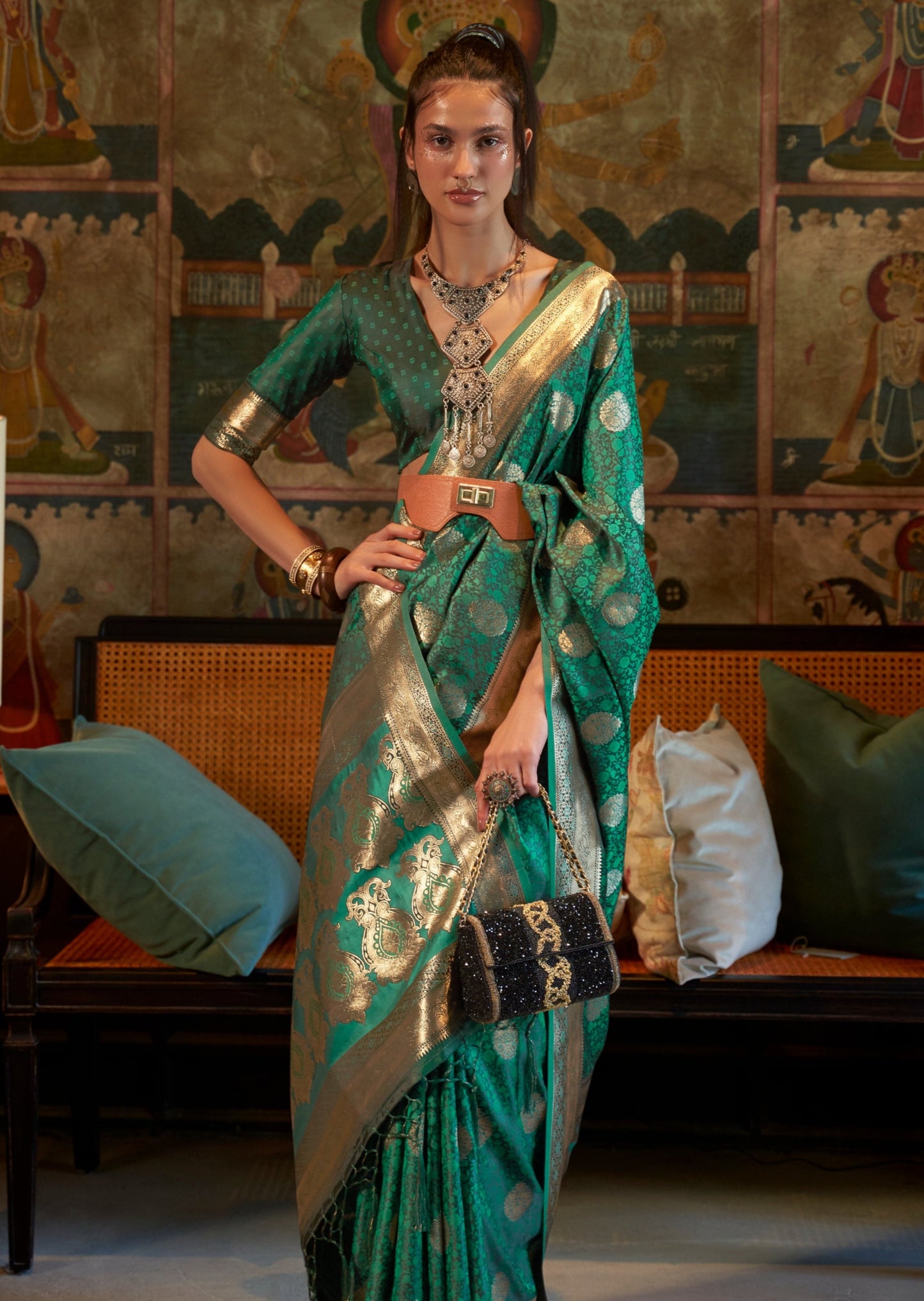 Woman in green color pure handloom banarasi satin silk saree blouse having traditional design.