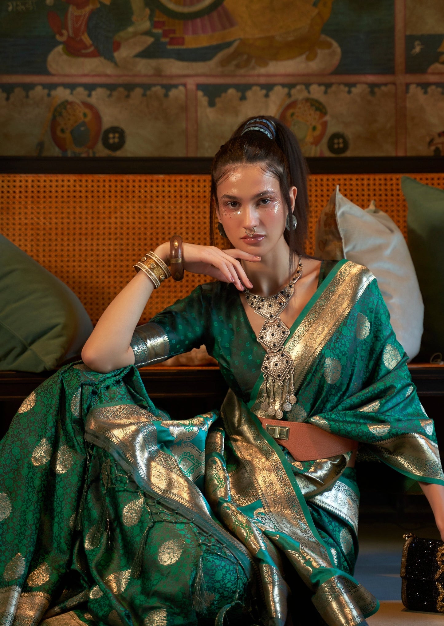 Bride in green colour handloom banarasi satin silk saree in green color.
