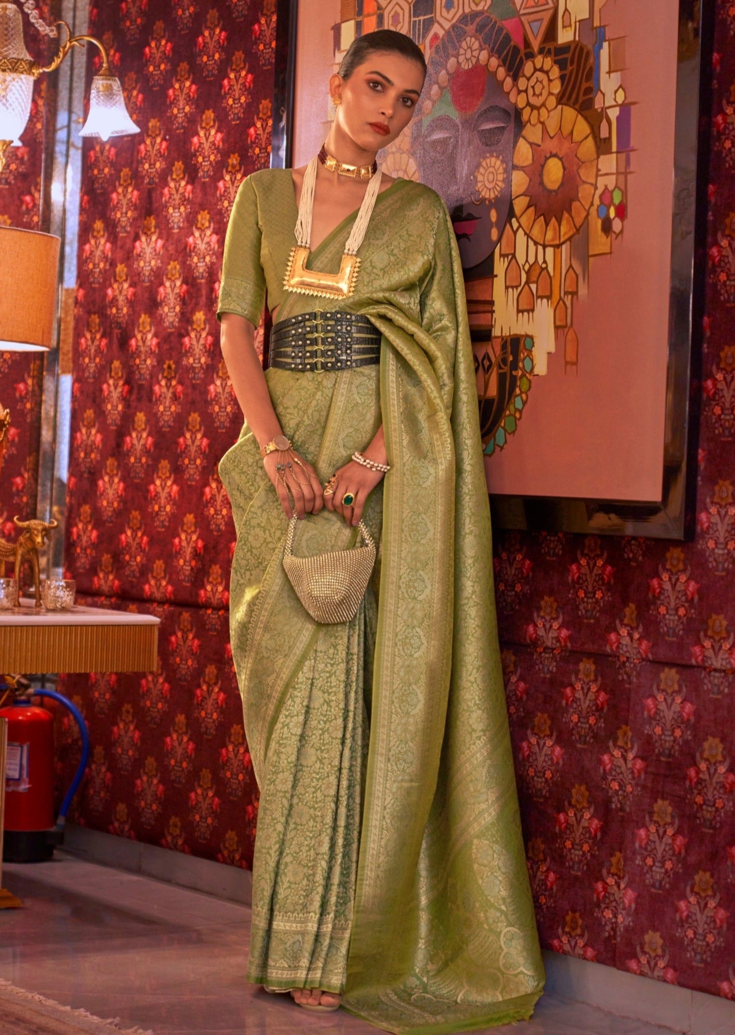 Woman in pure banarasi silk parrot green color handloom bridal saree.