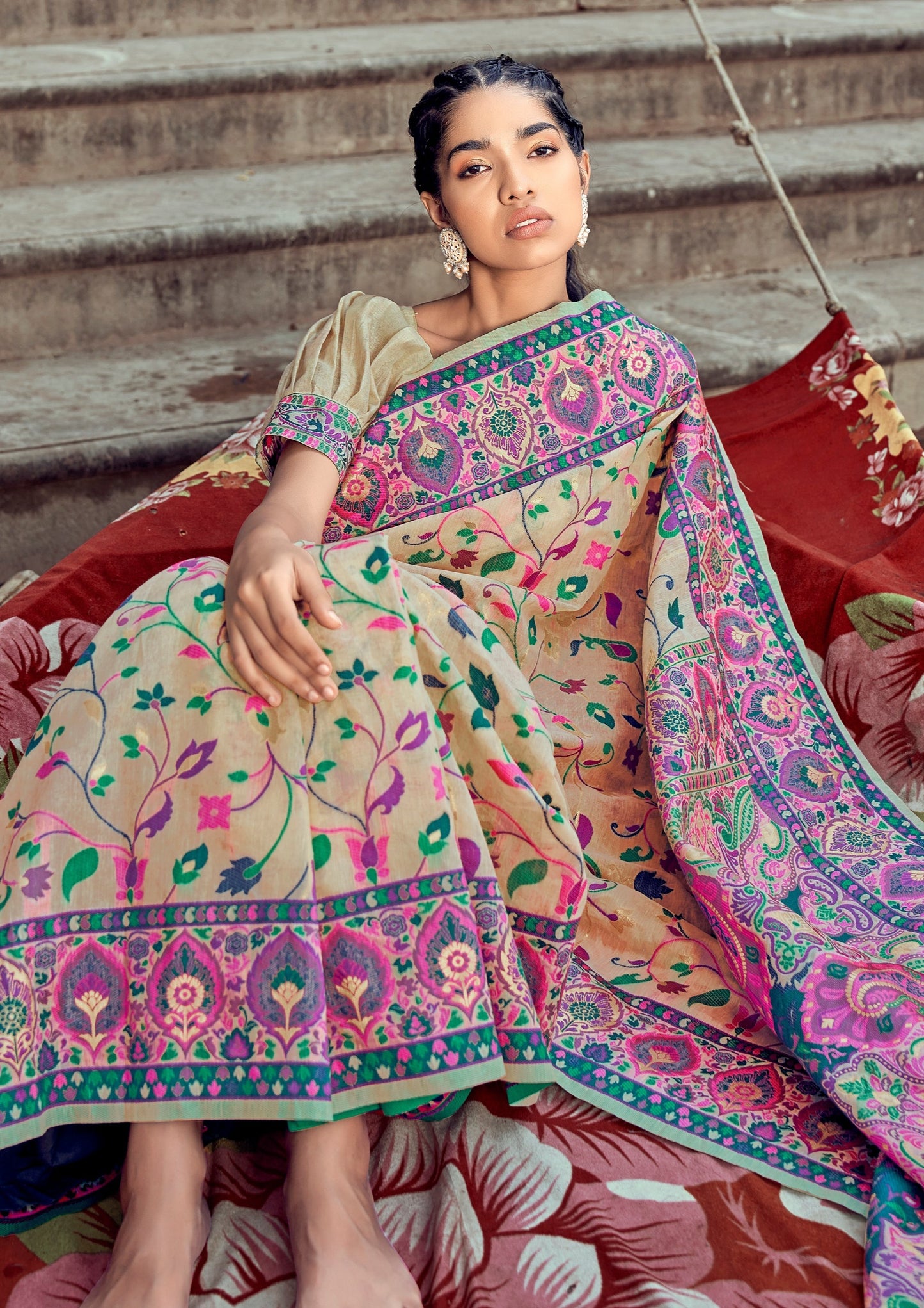 woman sitting in front of stairs on boat in Pure Kashmiri Pashmina Silk Embroidered Cream Handloom Saree
