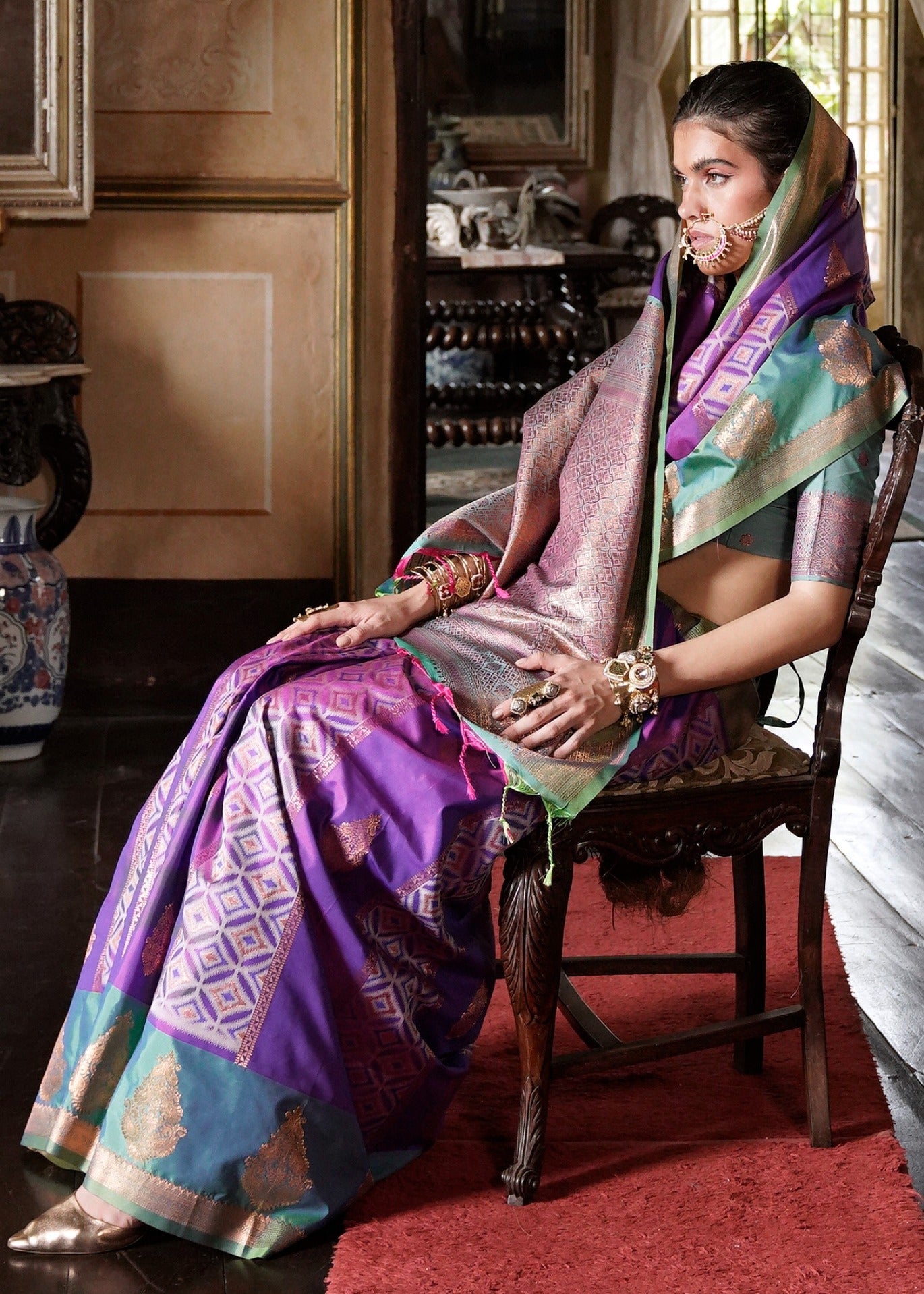 Bridal kanjivaram silk handloom saree in purple green color combination with contrast pallu available online in london uk.