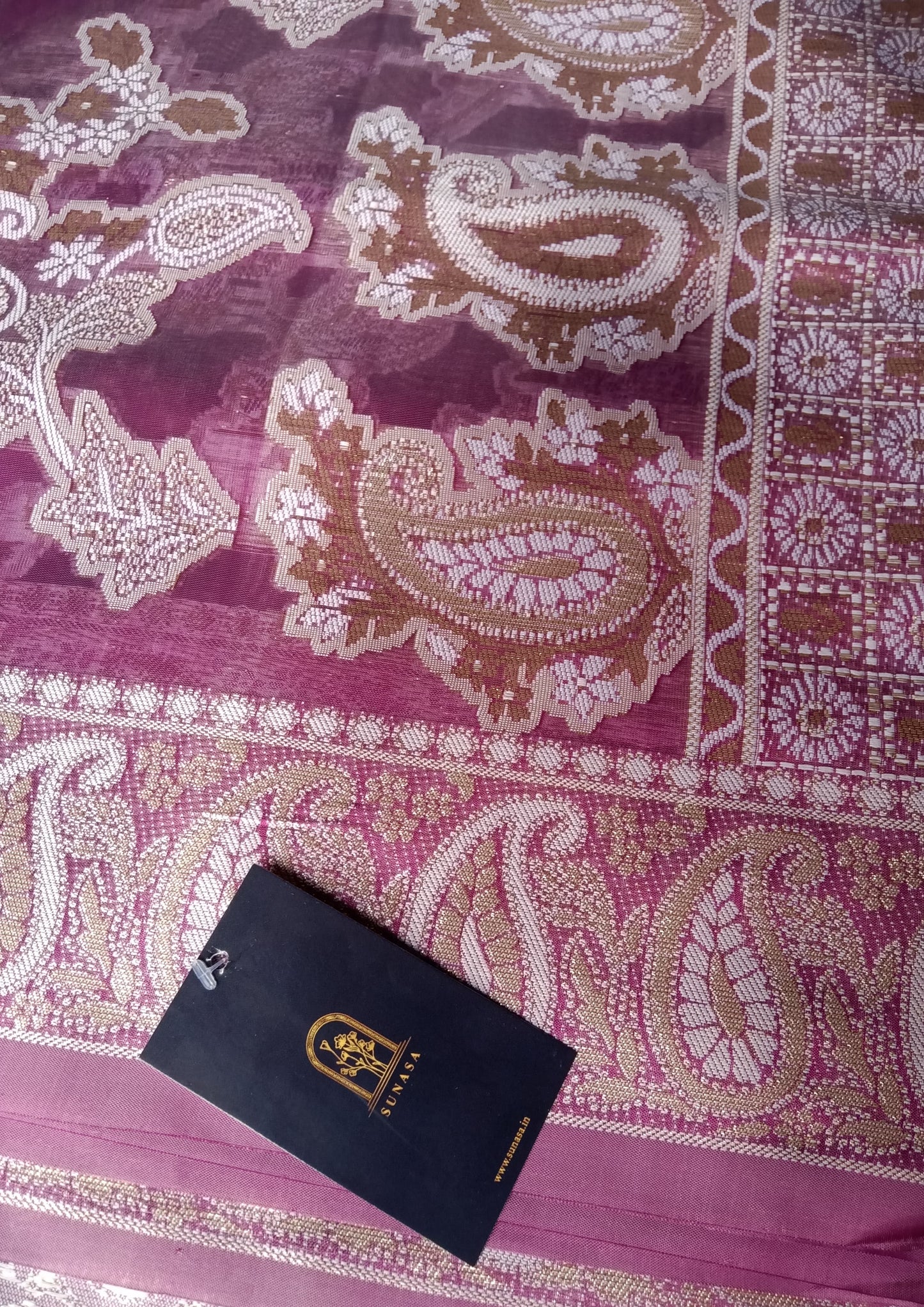 Zari work and lucknowi chikankari on purple organza saree.