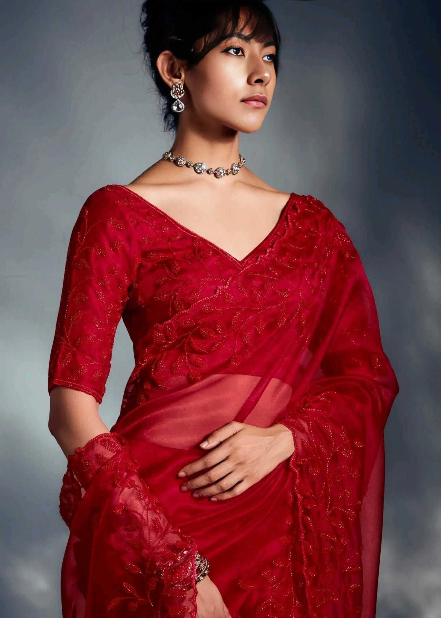 Luxury red tissue silk organza bridal saree online with heavy bead embroidery and handwoven detailing.