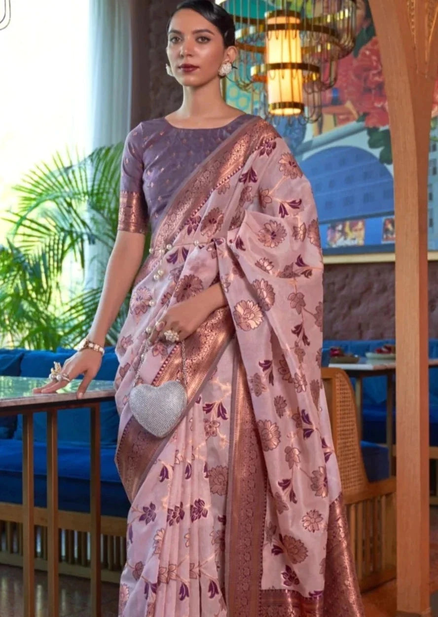 Woman in pure banarasi organza handloom saree in lilac purple color.