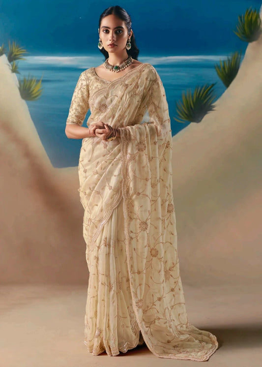 Cream organza tissue silk hand embroidered bridal saree with beadwork and sequins embroidery for daytime wedding, cocktail party, reception nights.