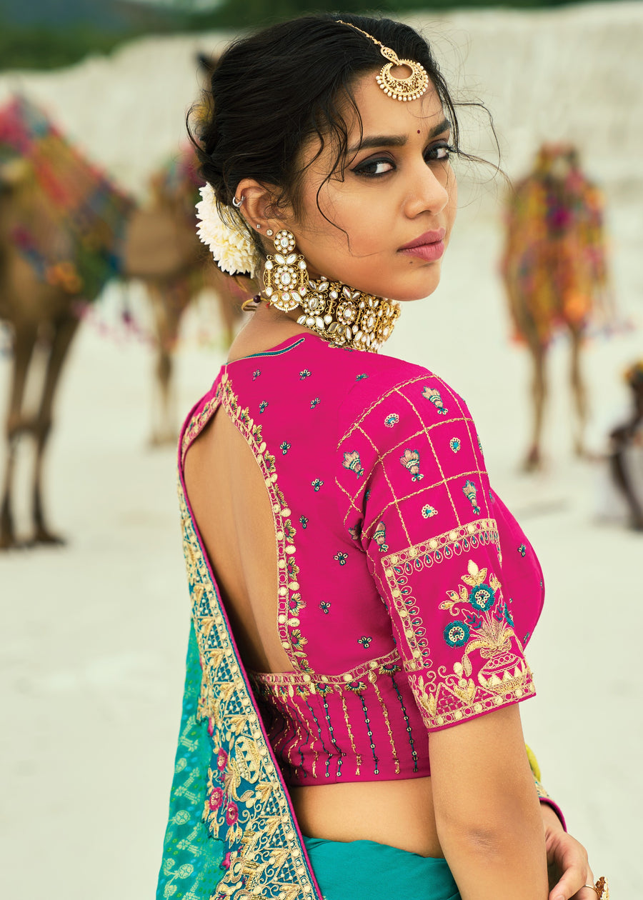 Handcrafted turquoise blue and yellow ombre bandhani (bandhej) saree with lightweight georgette fabric and festive drape.