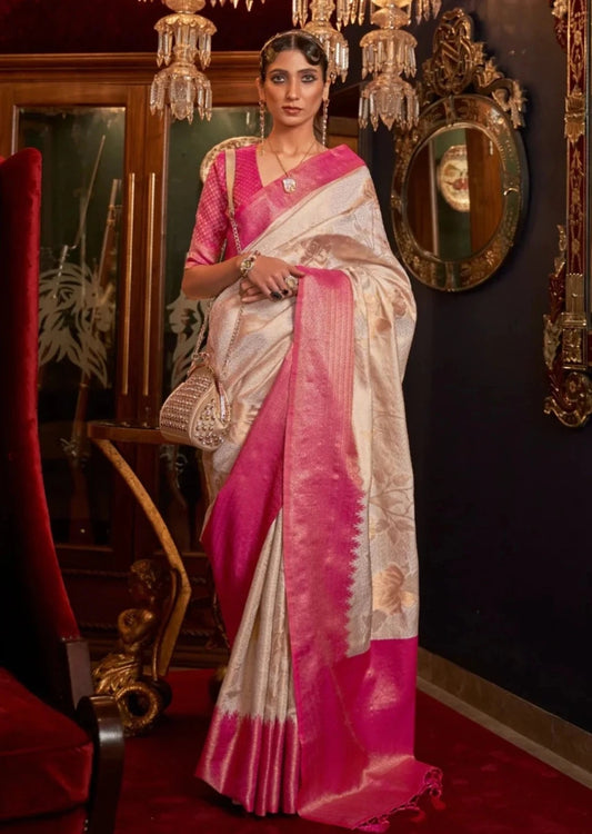 Bride in white kanjivaram silk saree and pink blouse.