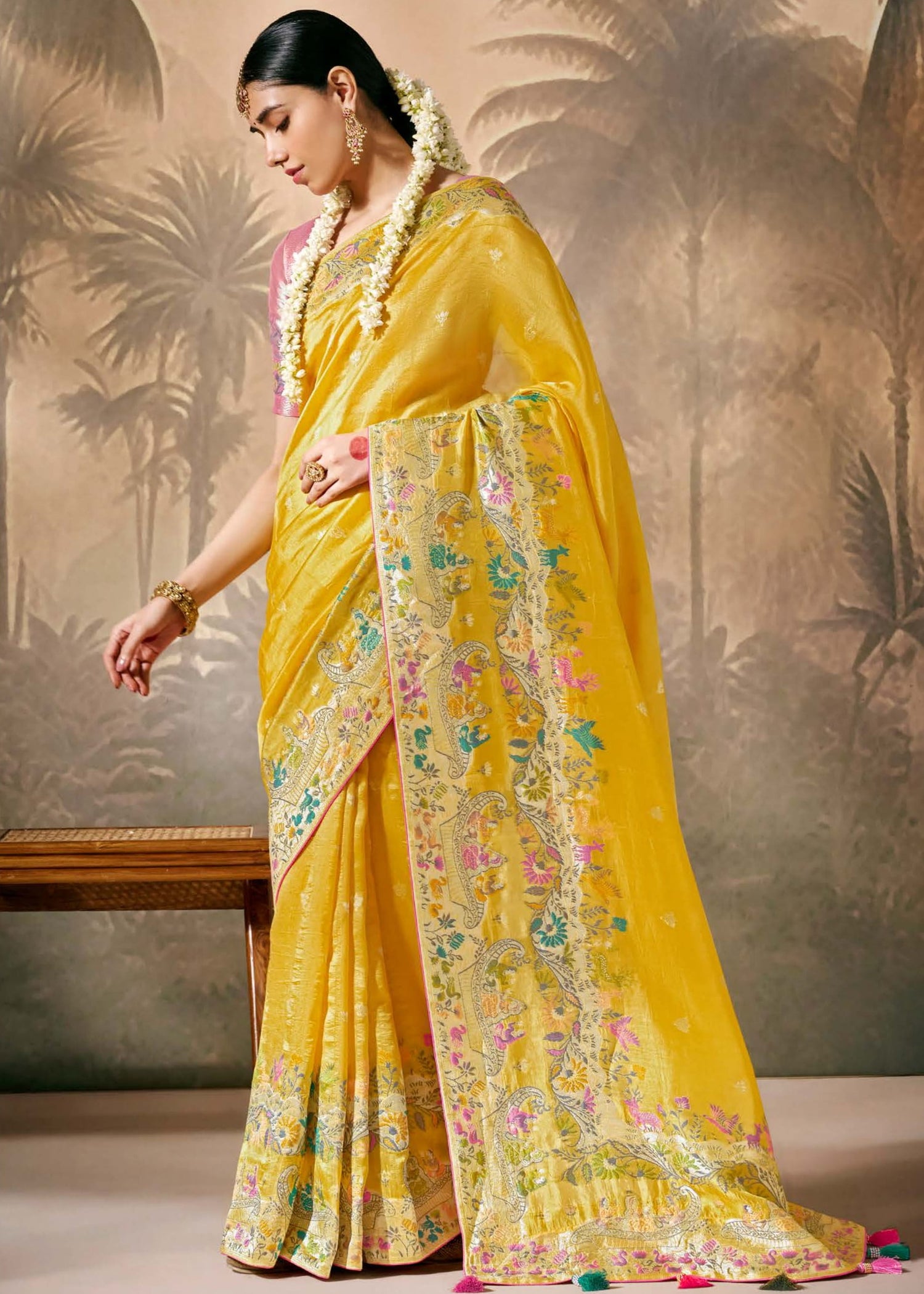 Yellow banarasi silk saree with pink blouse online for haldi look.