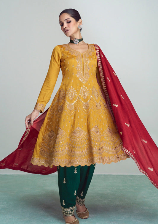 Bride in yellow silk salwar suit and red dupatta in usa online.