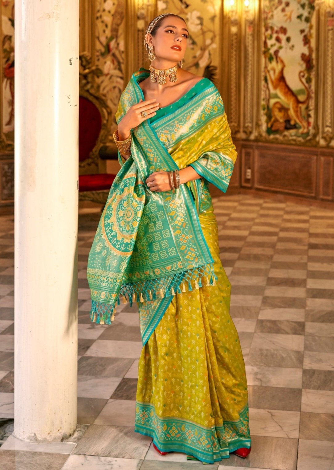 Yellow patola silk saree in usa for online shopping for wedding function look having zari weaving work on border.
