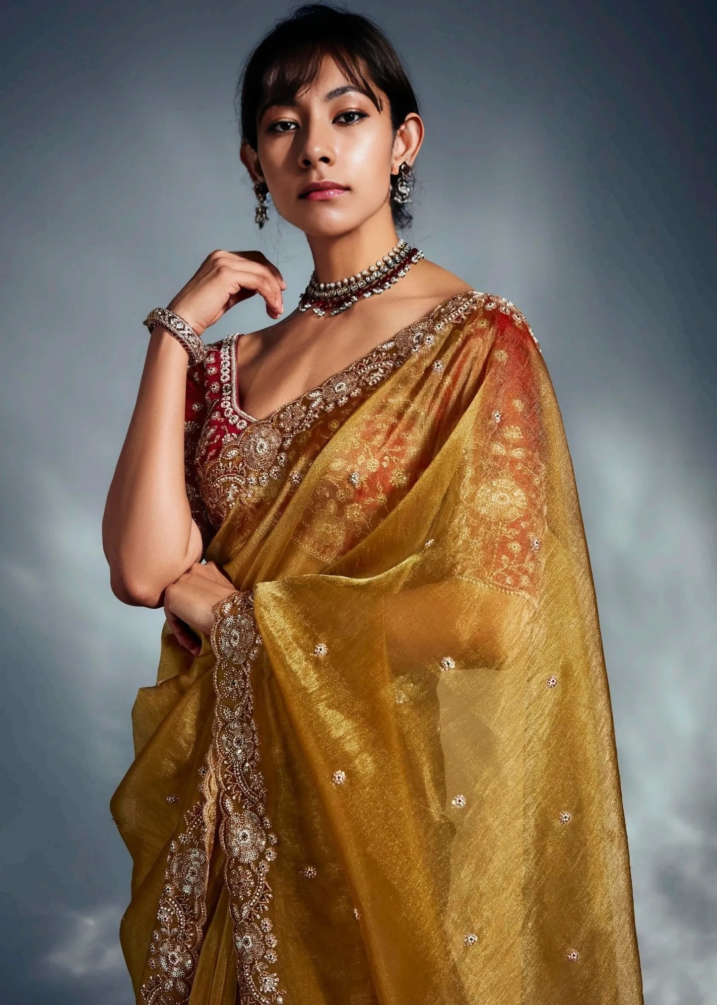 Designer embroidered tissue silk saree in usa online for festive wear made in traditional design having golden mustard yellow and red color combination.