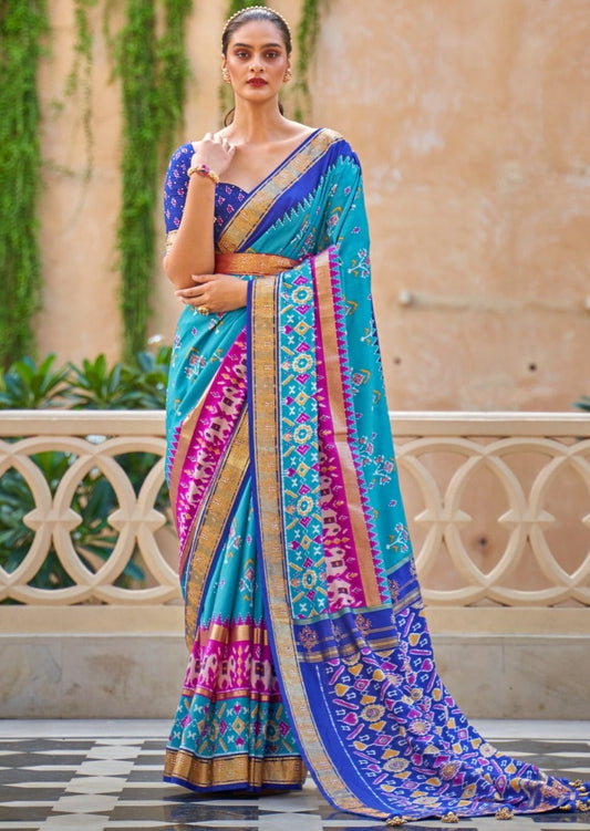 Blue Patola silk saree featuring two tones of firozi blue and royal blue available for online shopping worldwide.