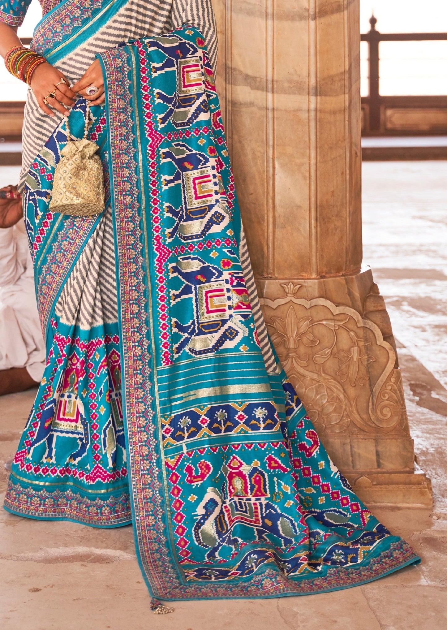 White and Turquoise Blue Sequins Leheriya Patola Saree
