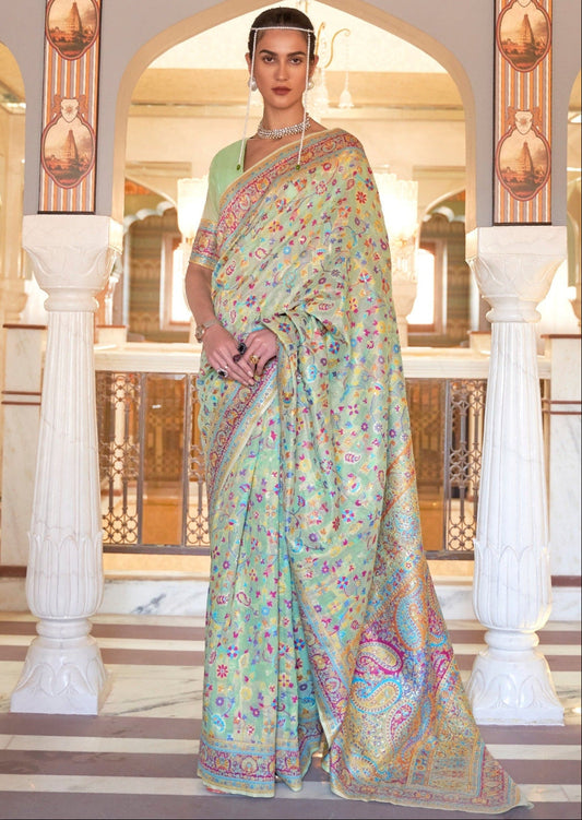 Luxury saree brands for kashmiri pashmina silk handloom weaving sarees online; showcasing sea green color saree design with multicolor floral motifs.