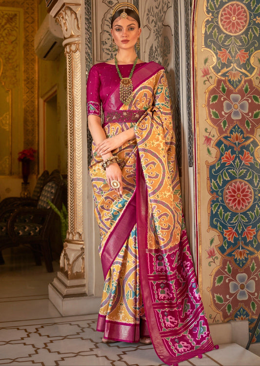Single ikat Patola saree in yellow color with red border and red blouse available for online shopping worldwide. Free shipping!
