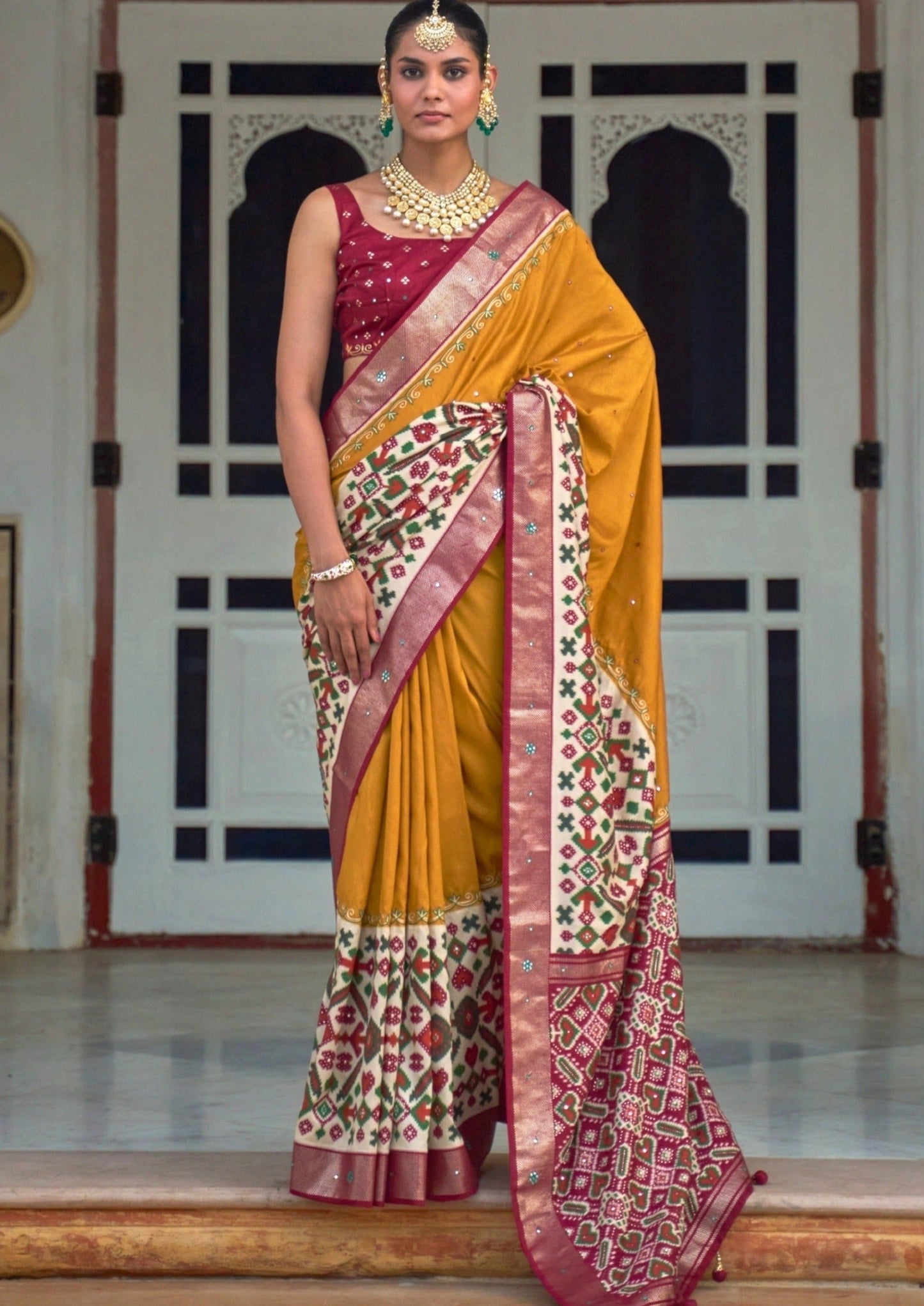 Aari work yellow Patola saree