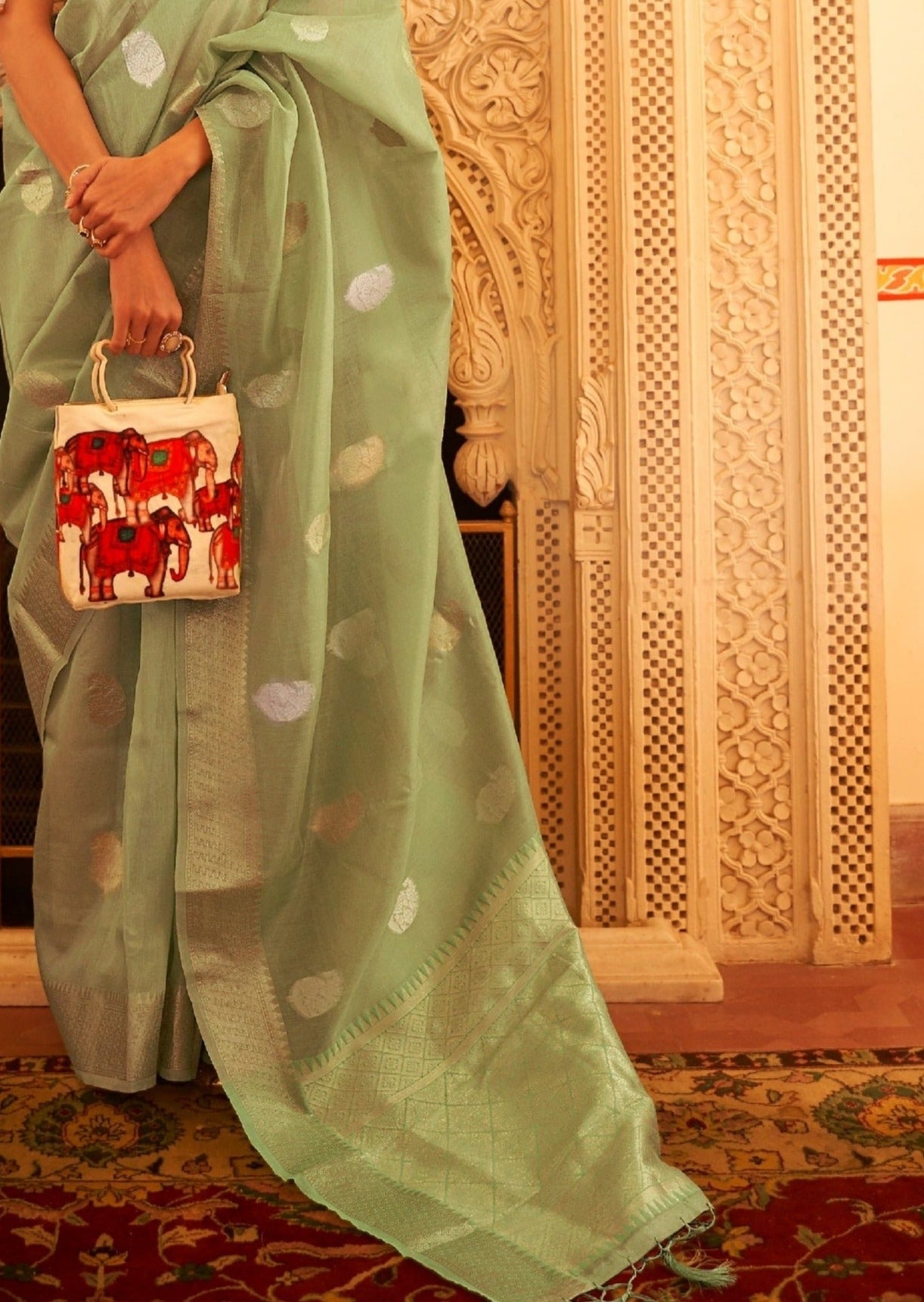 Tissue saree pallu traditional designs online shopping for summer wedding.