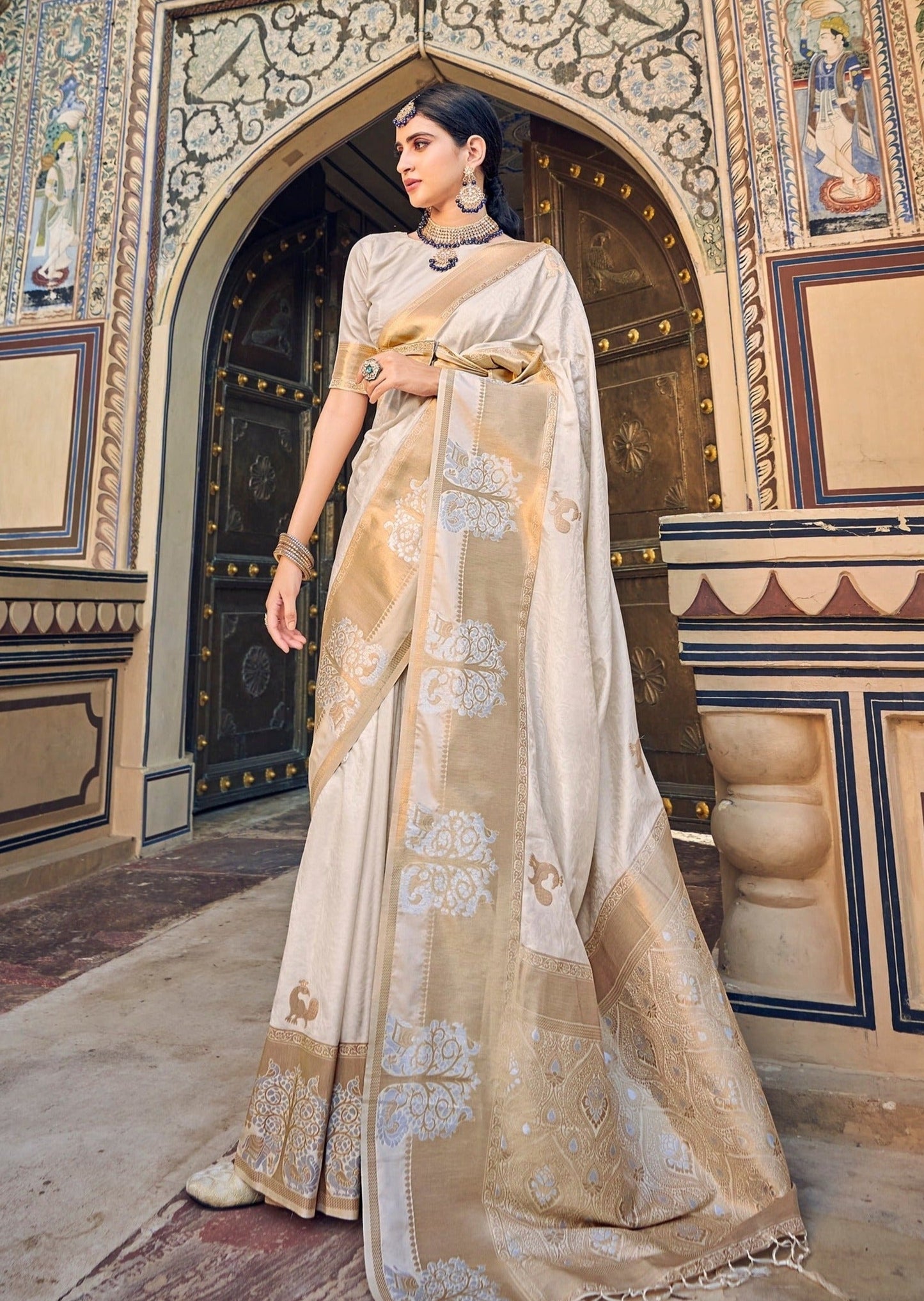 White banarasi saree online with golden border.