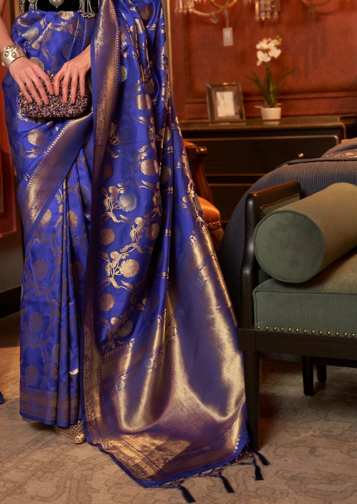 Banarasi silk royal blue saree with intricate gold zari work and traditional motifs, perfect for weddings and festive occasions.