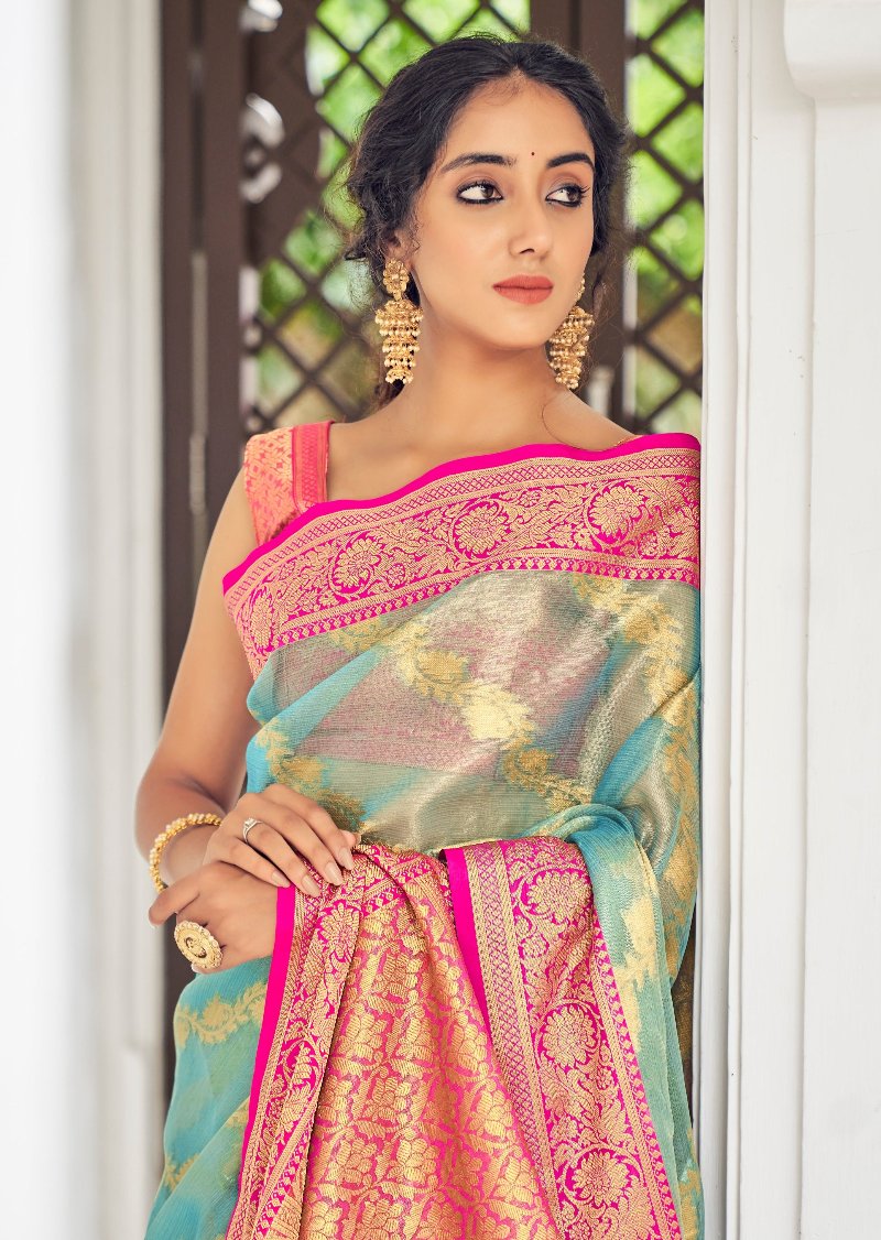 Pastel blue banarasi tissue silk handloom saree online with heavy zari weaving border design and contrast pink blouse.