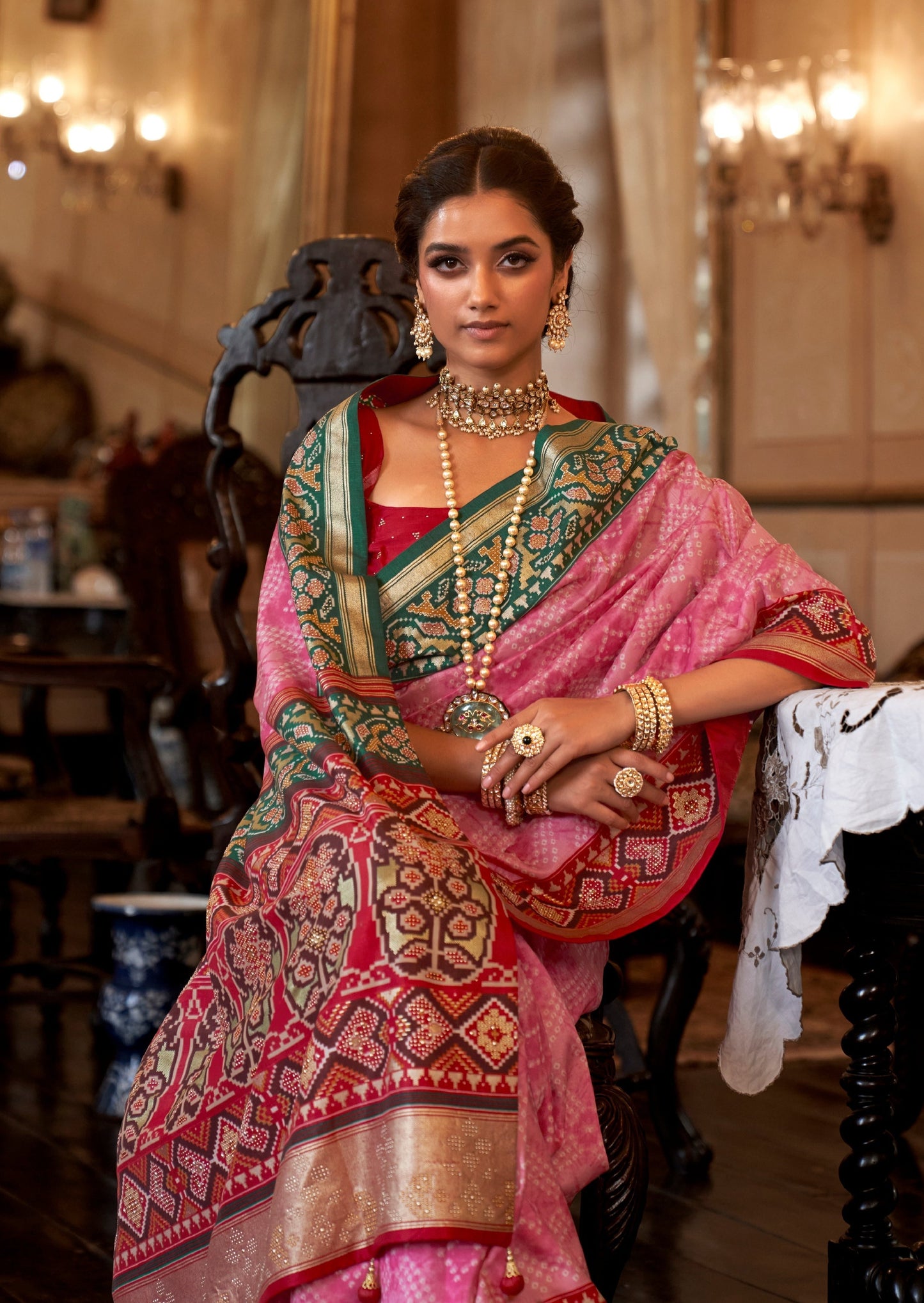 Pink double ikkat patola and bandhani fusion saree.